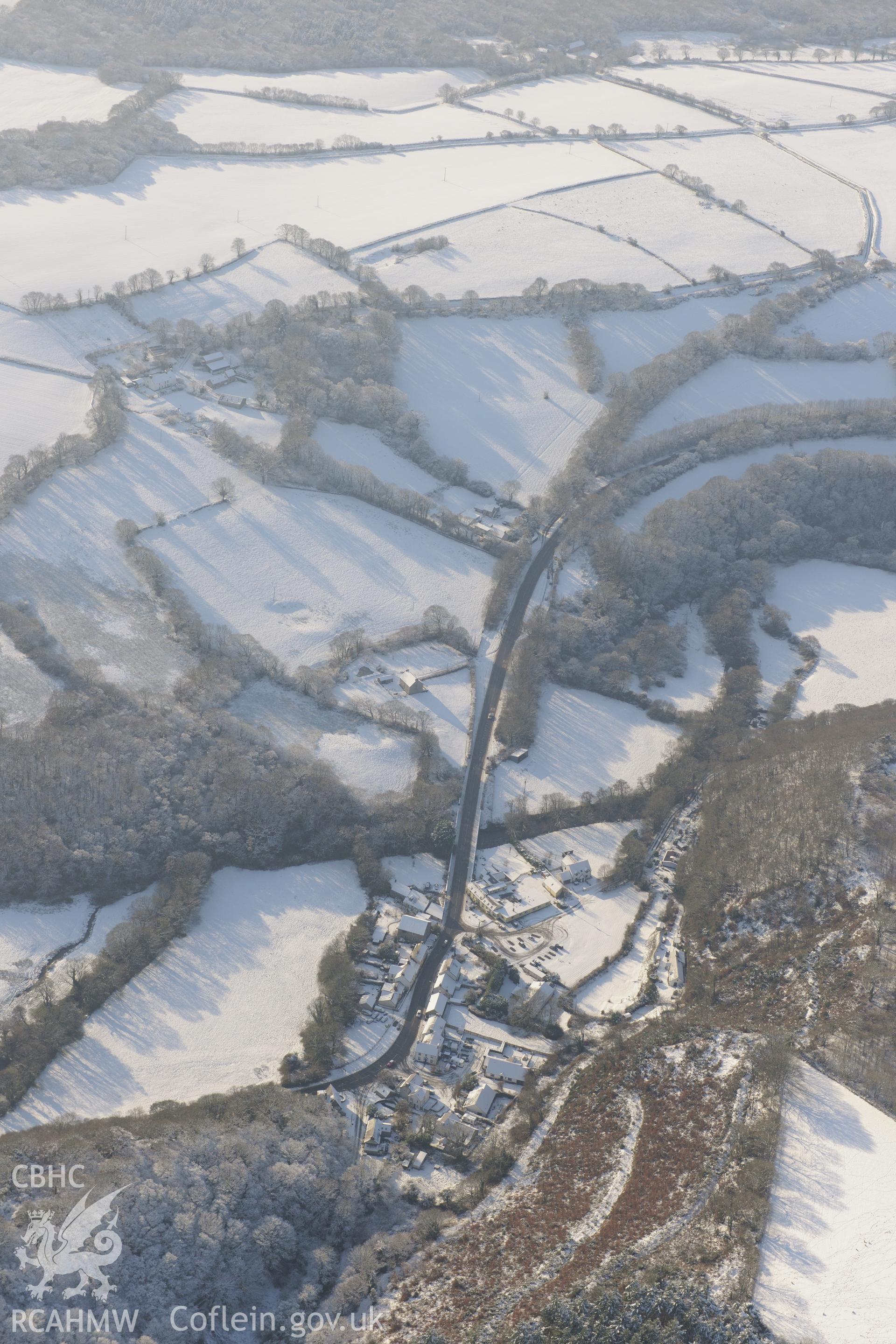 Felindre Farchog, south west of Cardigan. Oblique aerial photograph taken during the Royal Commission?s programme of archaeological aerial reconnaissance by Toby Driver on 24th January 2013.