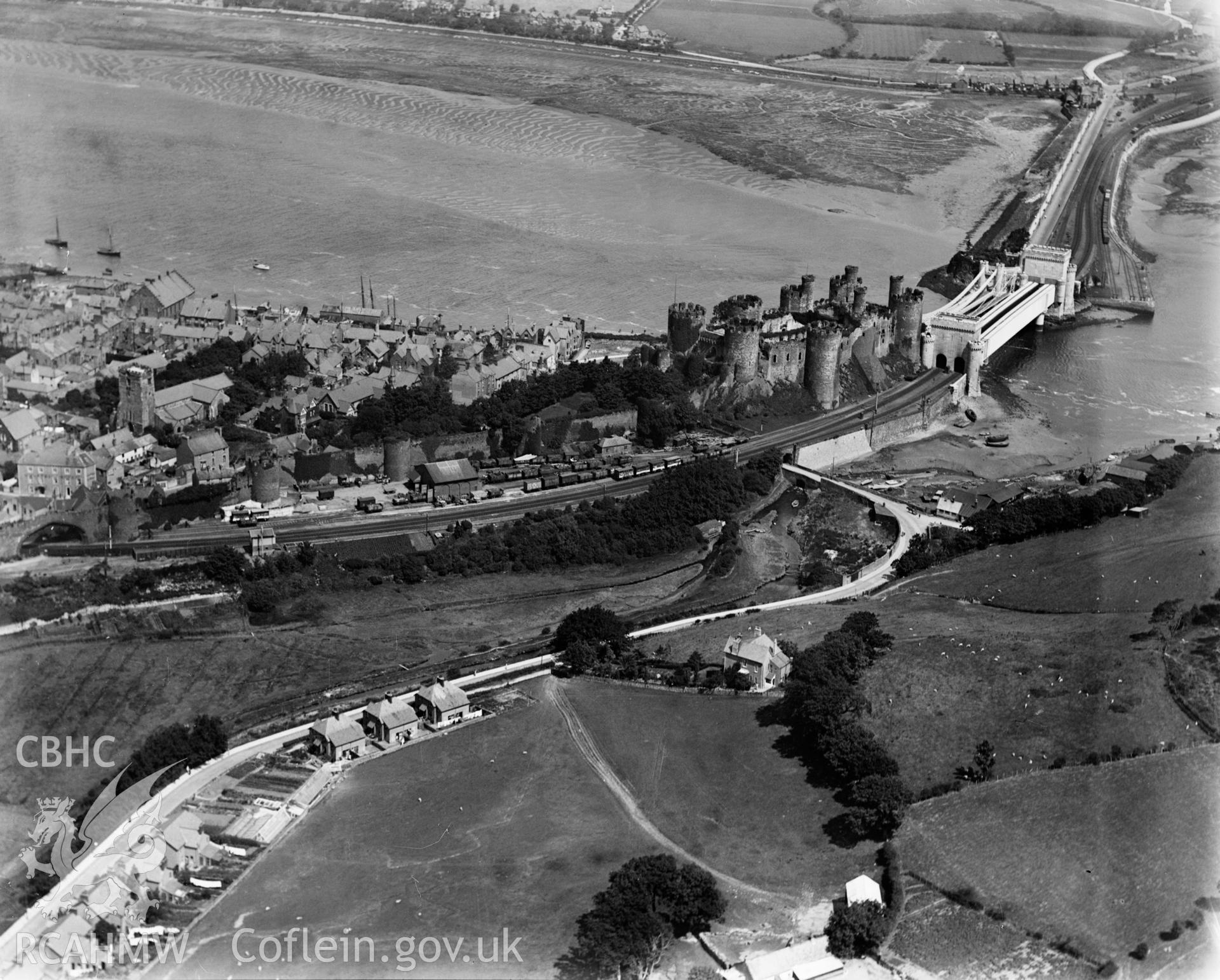 View of Conwy showing bridges, oblique aerial view. 5?x4? black and white glass plate negative.