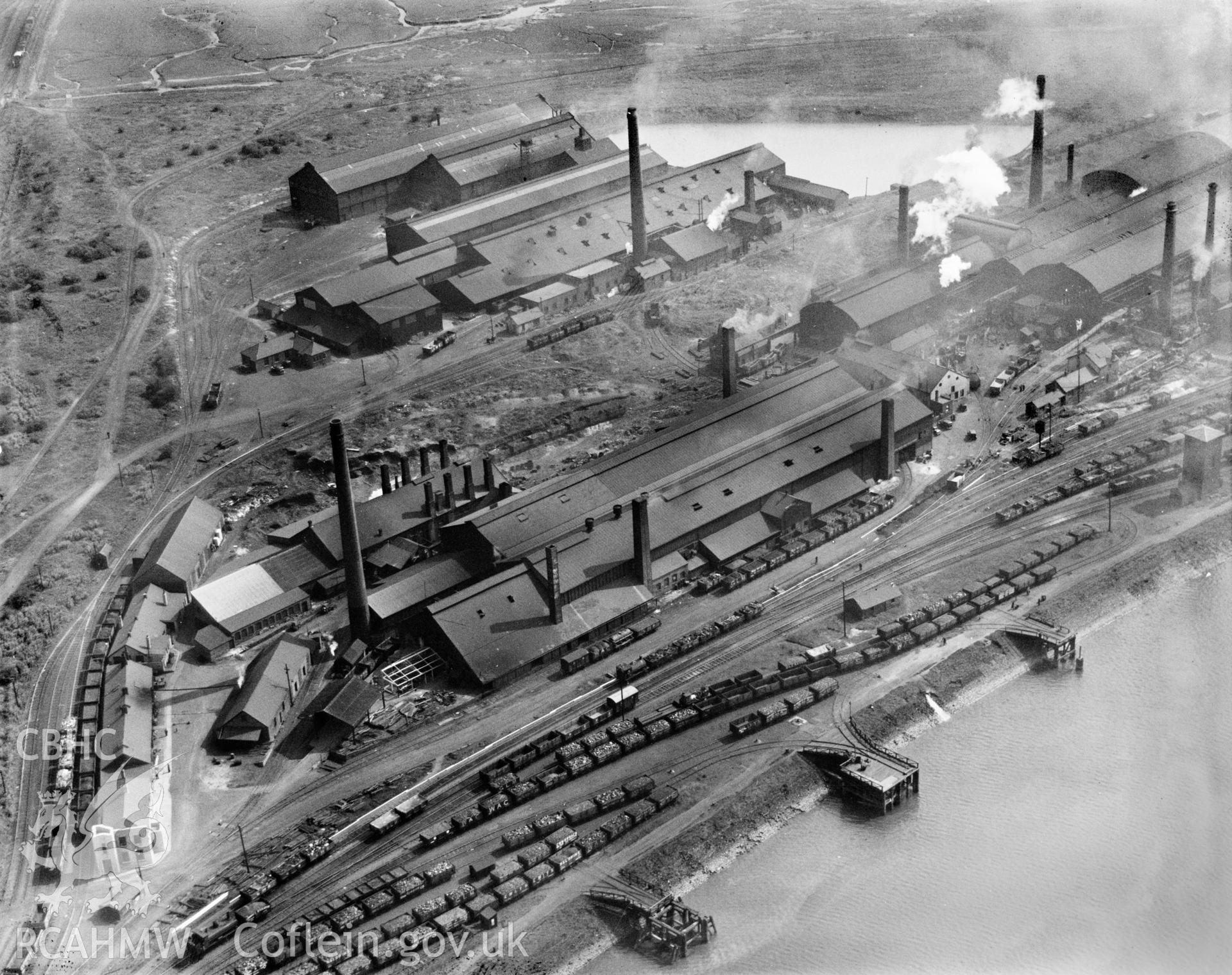 View of Baglan Bay tinplate works, Whitford and Albion works, Briton Ferry from the northwest, oblique aerial view. 5?x4? black and white glass plate negative.