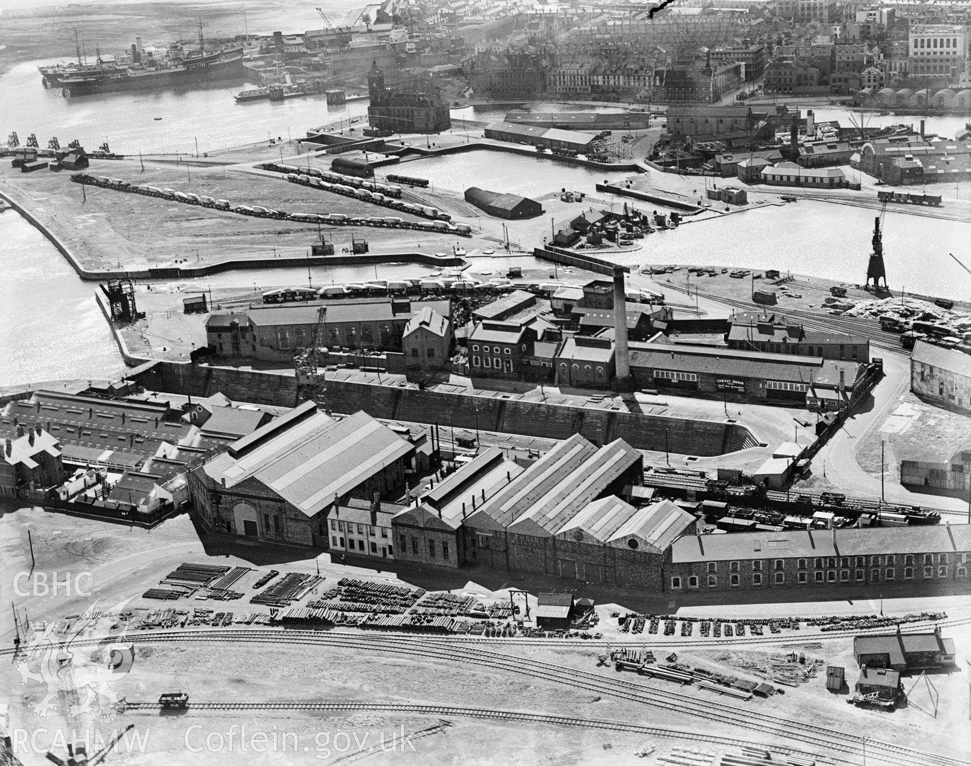 View of C.H. Bailey Ltd., dry dock owners & ship repairers and surrounding dockyard, Cardiff, oblique aerial view. 5?x4? black and white glass plate negative.