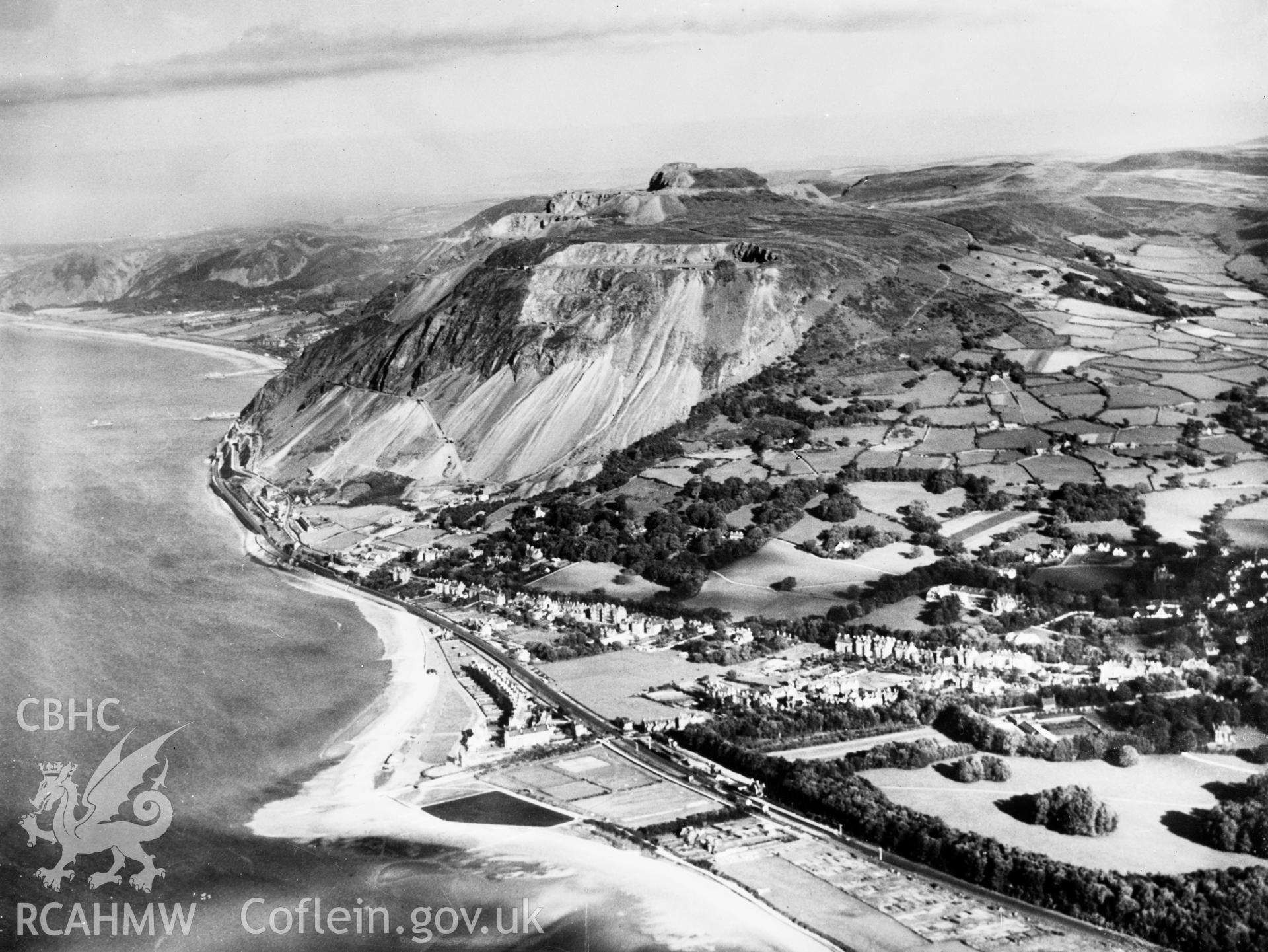 View of the newly completed Pen-y-clip road tunnels at Penmaenmawr showing Llanfairfechan. Oblique aerial photograph, 5?x4? BW glass plate.