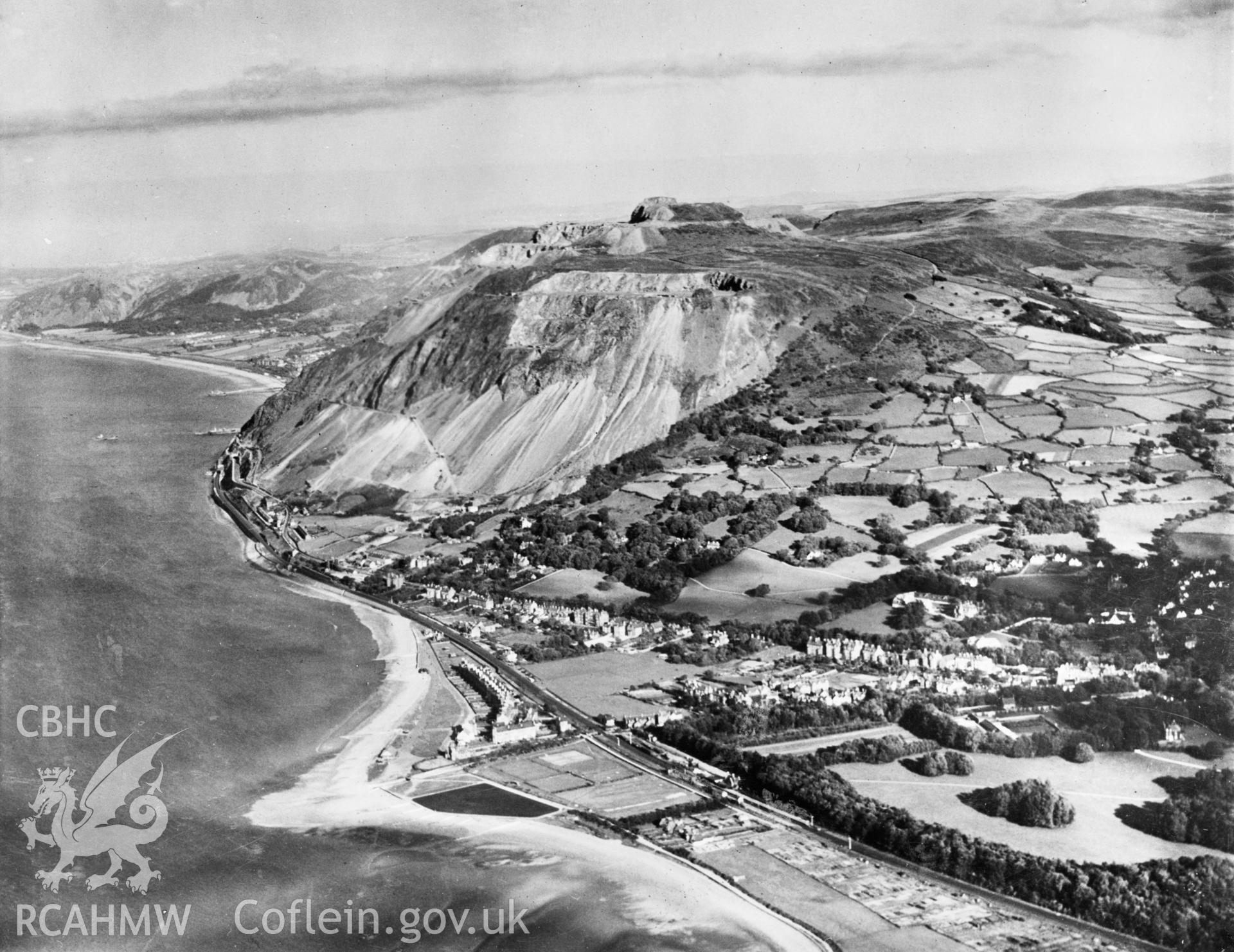 View of the newly completed Pen-y-clip road tunnels at Penmaenmawr showing Llanfairfechan. Oblique aerial photograph, 5?x4? BW glass plate.