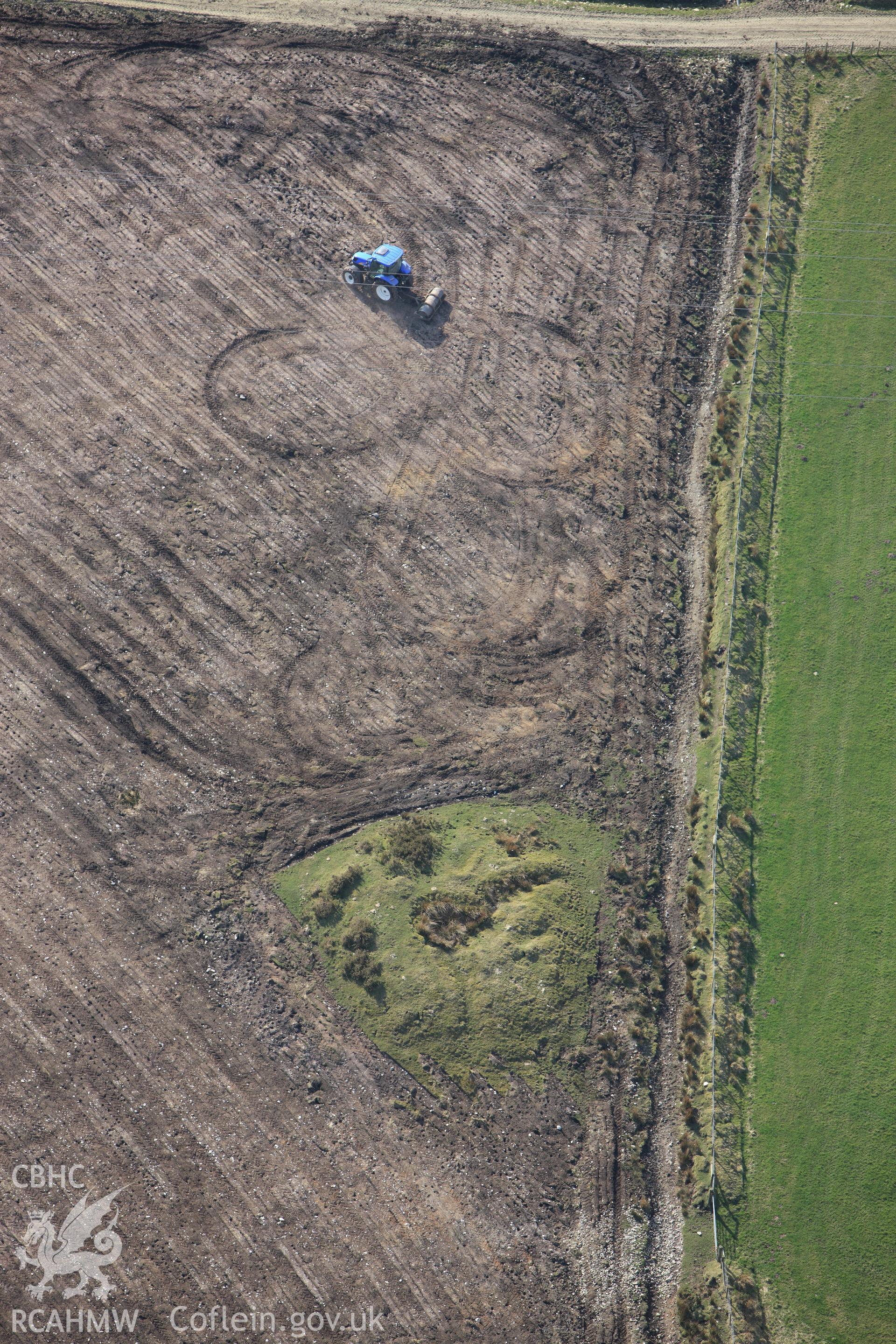 RCAHMW colour oblique aerial photograph of Cructarw with ploughing. Taken on 13 April 2010 by Toby Driver