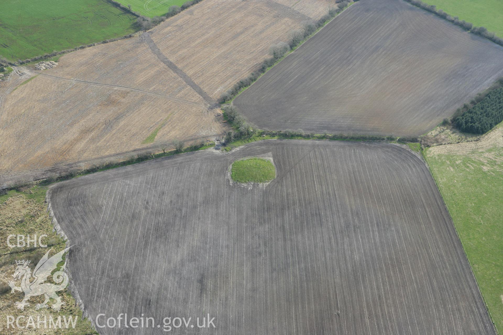 RCAHMW colour oblique aerial photograph of Crug Bach with ploughing. Taken on 13 April 2010 by Toby Driver