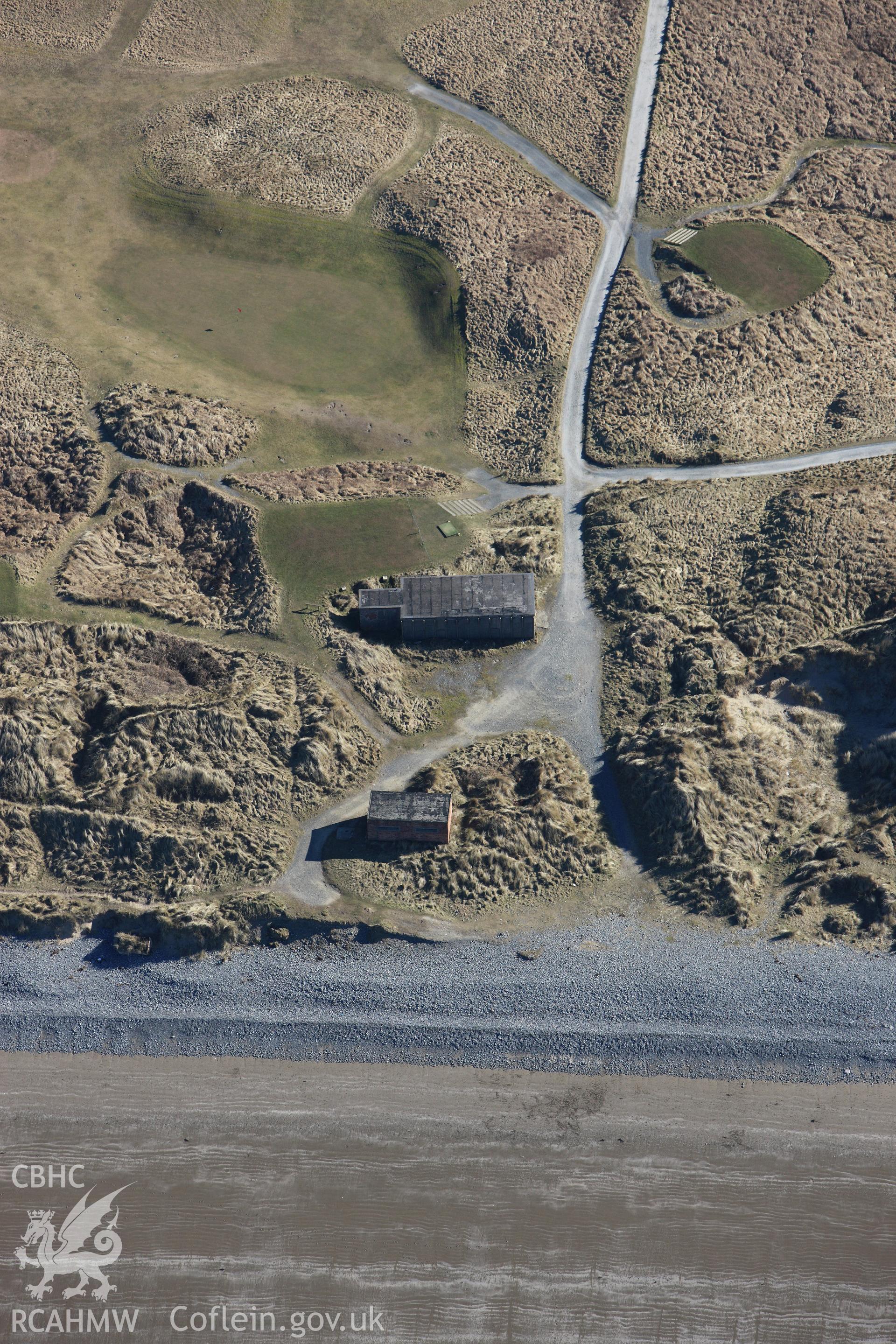 RCAHMW colour oblique photograph of MOS EE AA Extended British Concrete Federation hut and associated war time buildings, Ynyslas. Taken by Toby Driver on 08/03/2010.