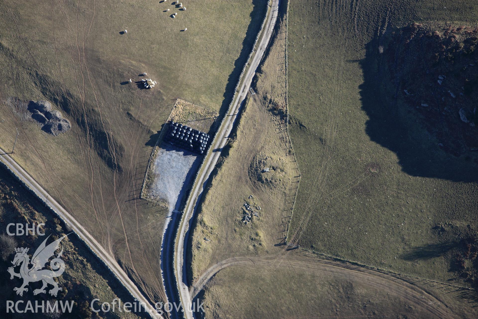 RCAHMW colour oblique photograph of Bedd Taliesin round barrow. Taken by Toby Driver on 08/03/2010.