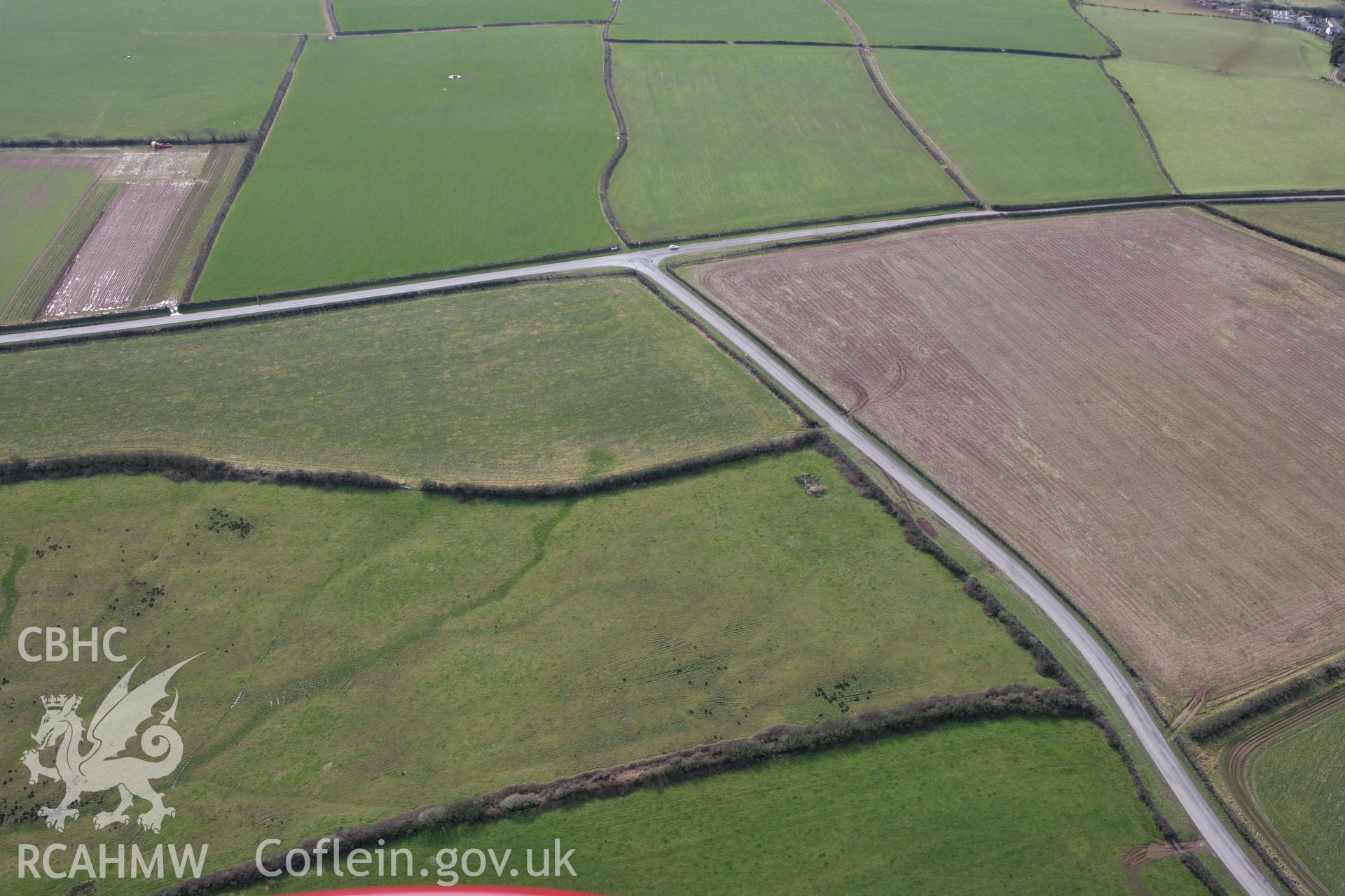 RCAHMW colour oblique aerial photograph of Wallaston Round Barrow IV. Taken on 02 March 2010 by Toby Driver