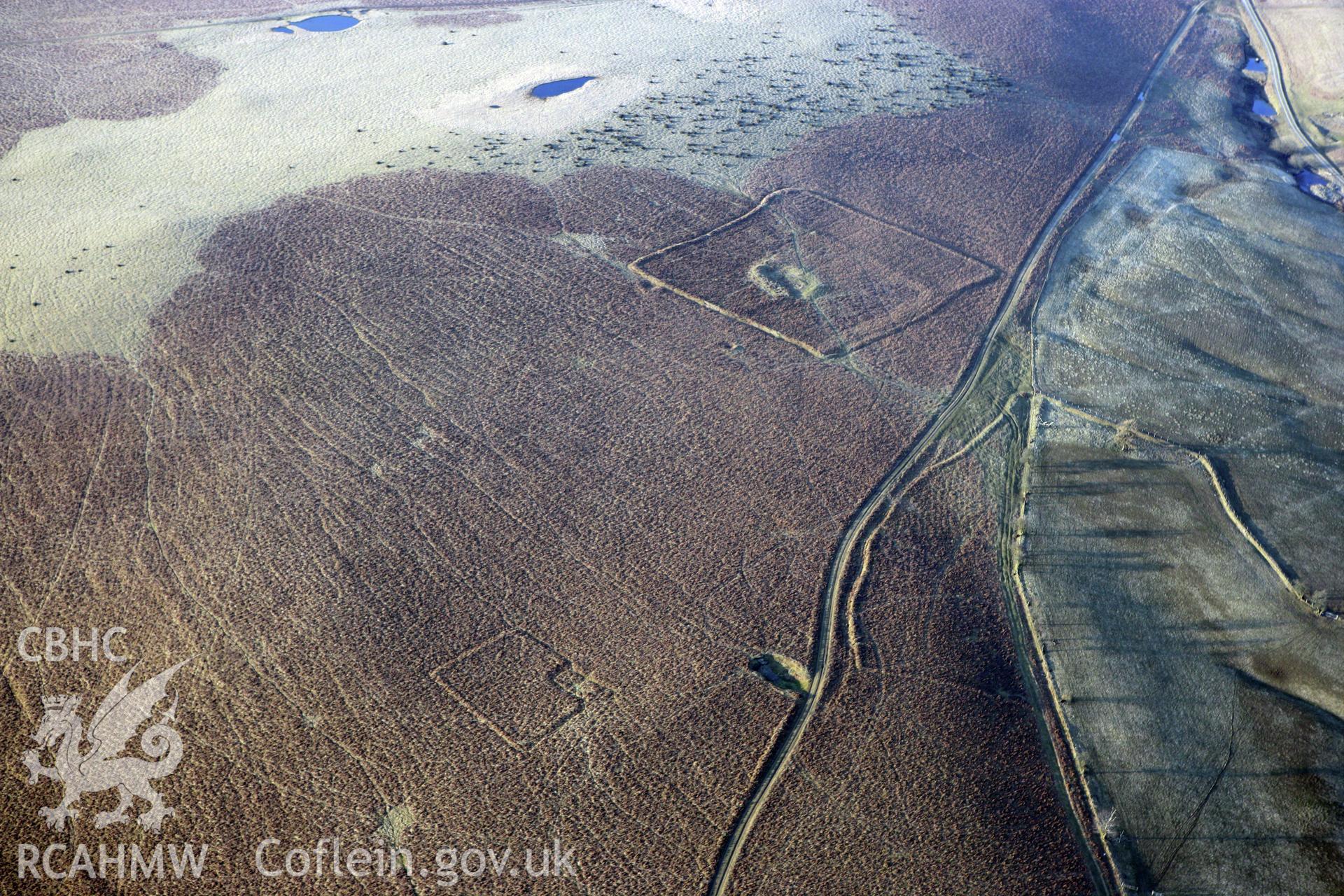 RCAHMW colour oblique photograph of Cwmblaenerw Enclosed Long Hut. Taken by Toby Driver on 11/03/2010.