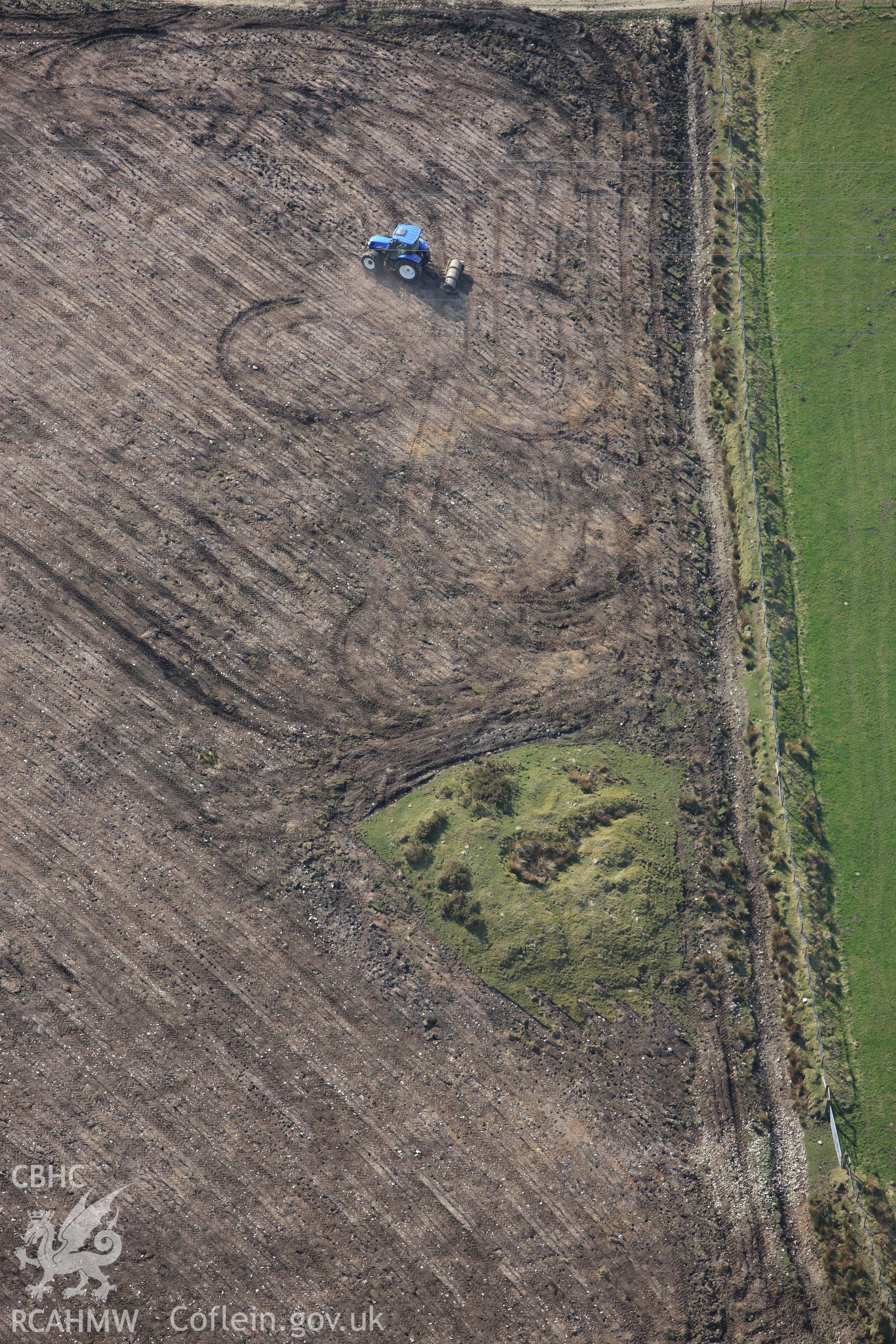 RCAHMW colour oblique aerial photograph of Cructarw with ploughing. Taken on 13 April 2010 by Toby Driver