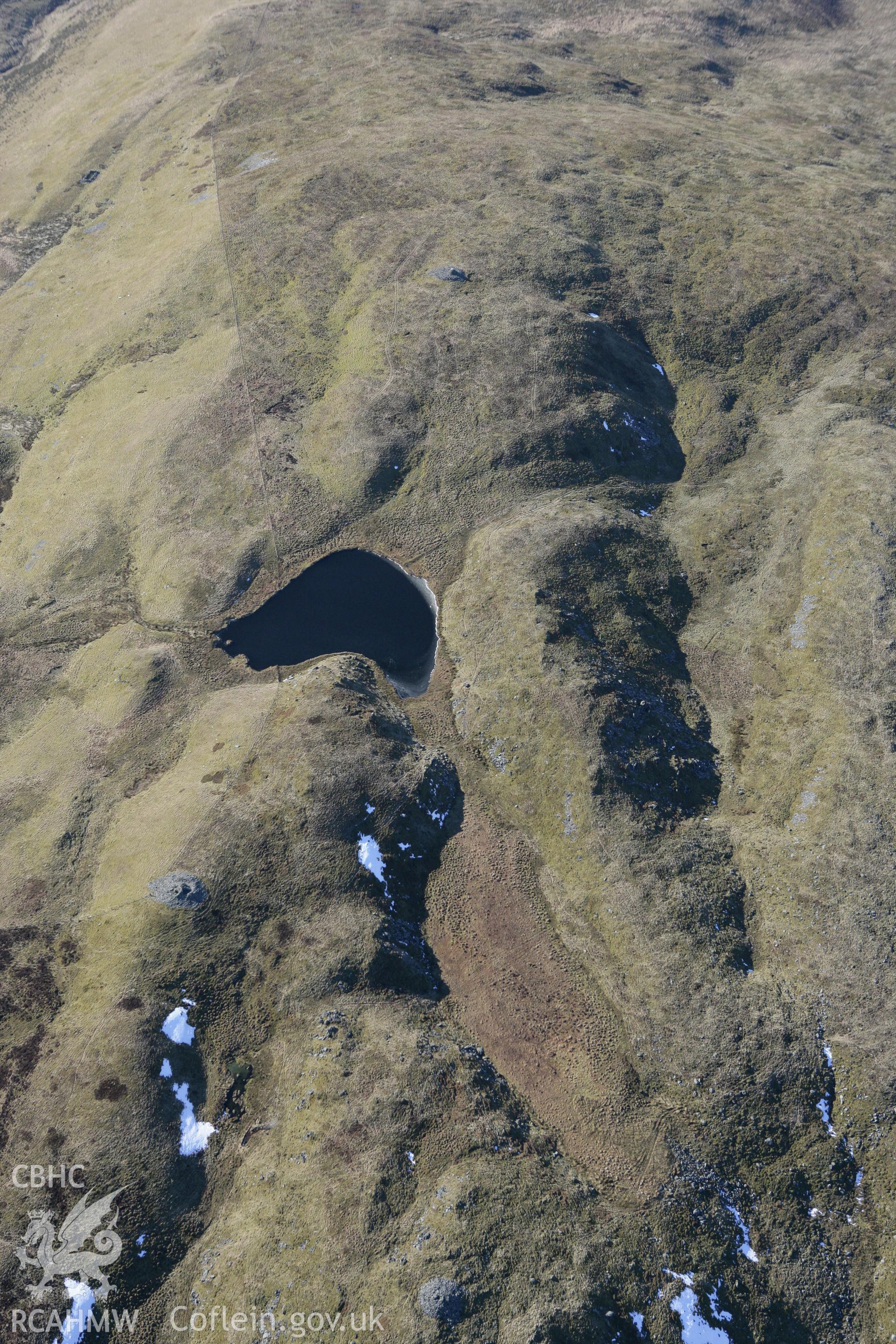 RCAHMW colour oblique photograph of Moel y Llyn cairn. Taken by Toby Driver on 08/03/2010.