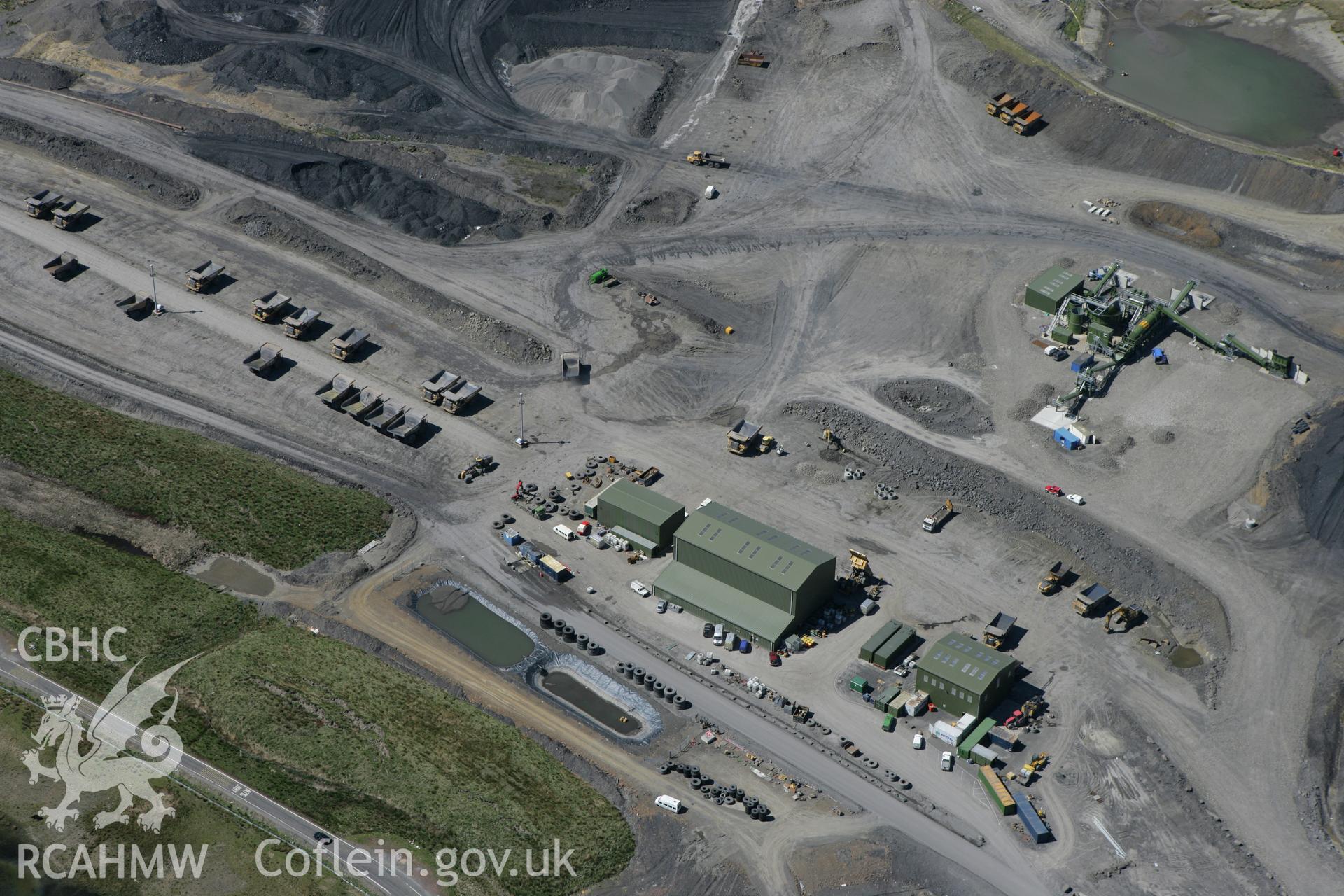 RCAHMW colour oblique photograph of Buildings and Tre-hir pond at Dowlais Opencast Mine, Merthyr Tydfil. Taken by Toby Driver on 24/05/2010.