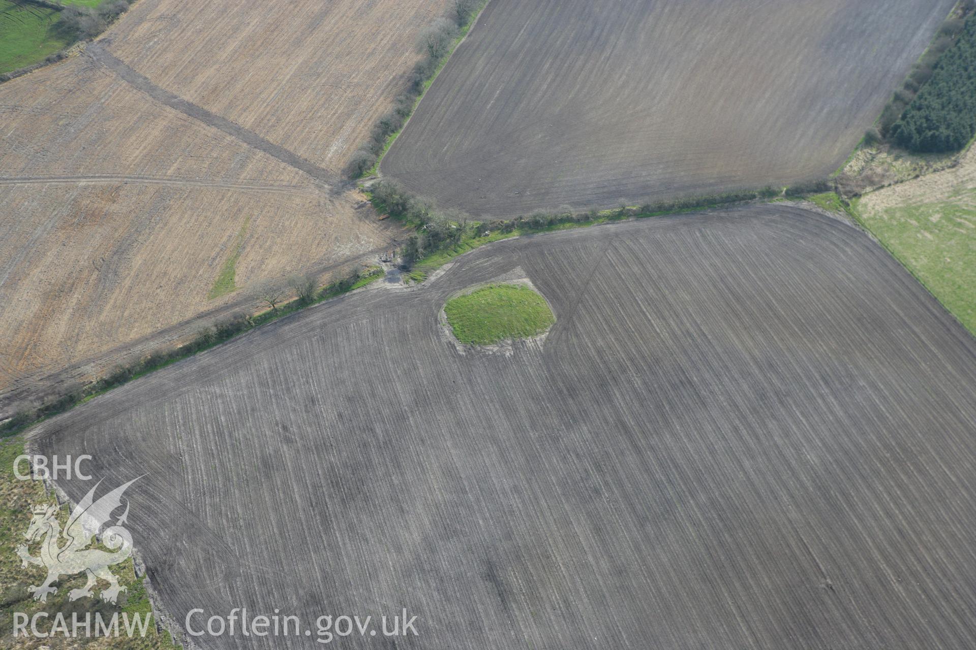 RCAHMW colour oblique aerial photograph of Crug Bach with ploughing. Taken on 13 April 2010 by Toby Driver