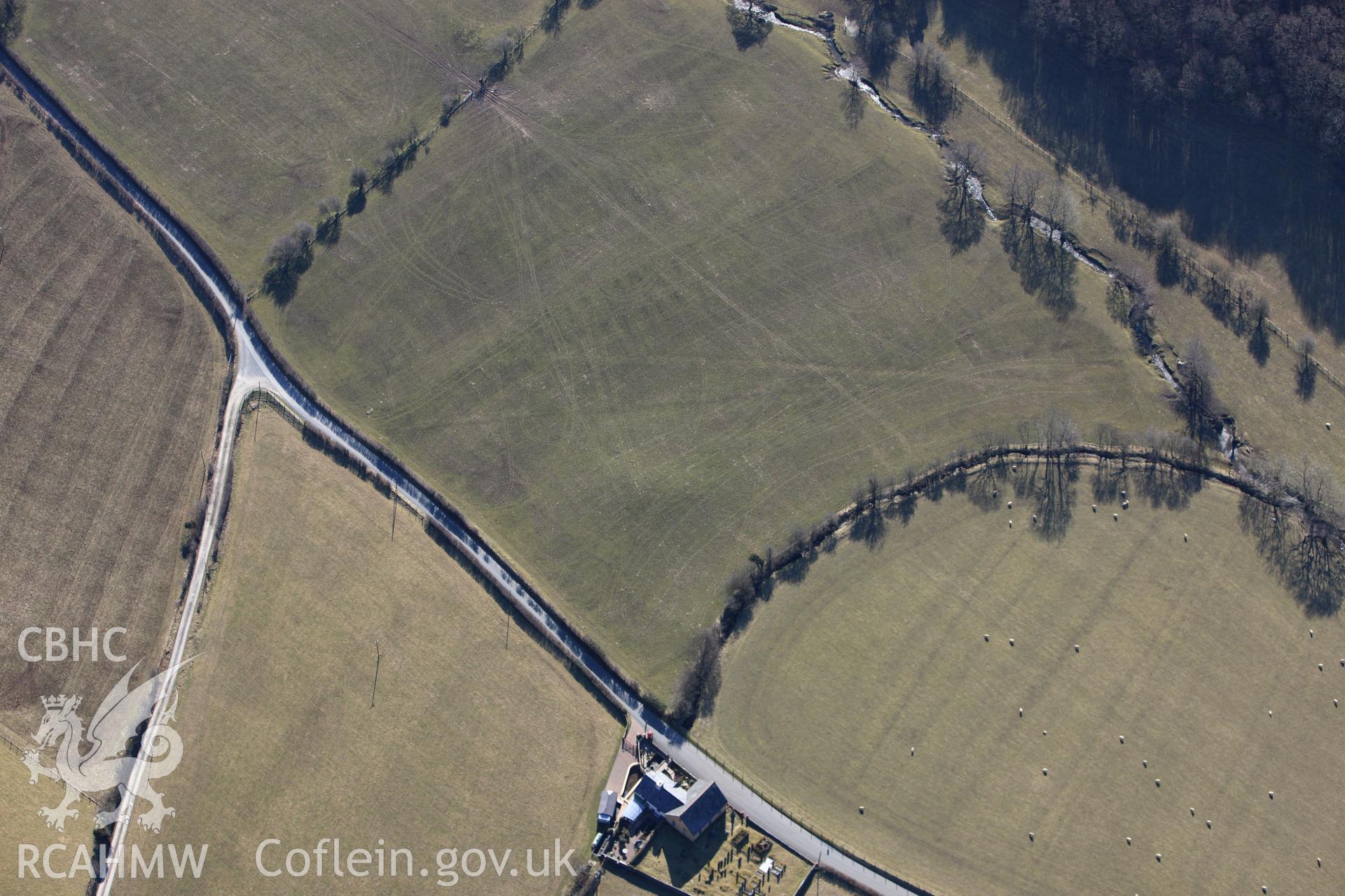 RCAHMW colour oblique photograph of Dyffryn Gwyn (Capel Maethon) round barrow. Taken by Toby Driver on 08/03/2010.