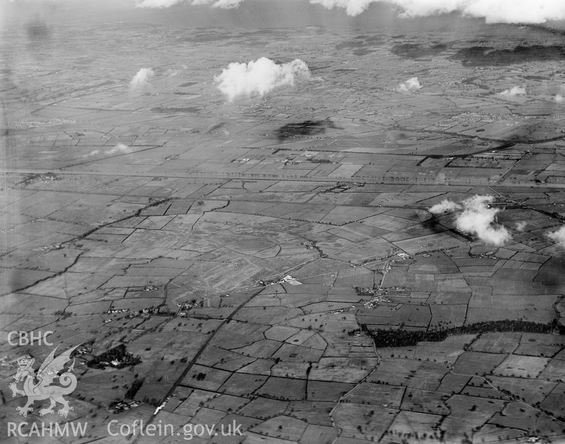 View of Vickers-Armstrong Ltd. works  - Broughton airfield under construction. Oblique aerial photograph, 5?x4? BW glass plate.