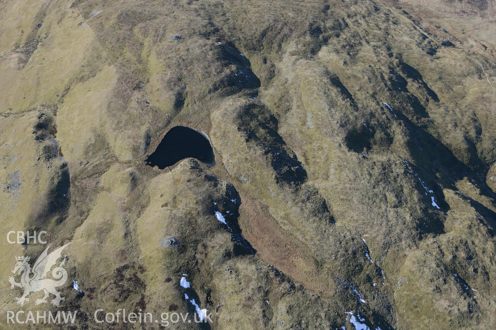 RCAHMW colour oblique photograph of Moel y Llyn cairn. Taken by Toby Driver on 08/03/2010.