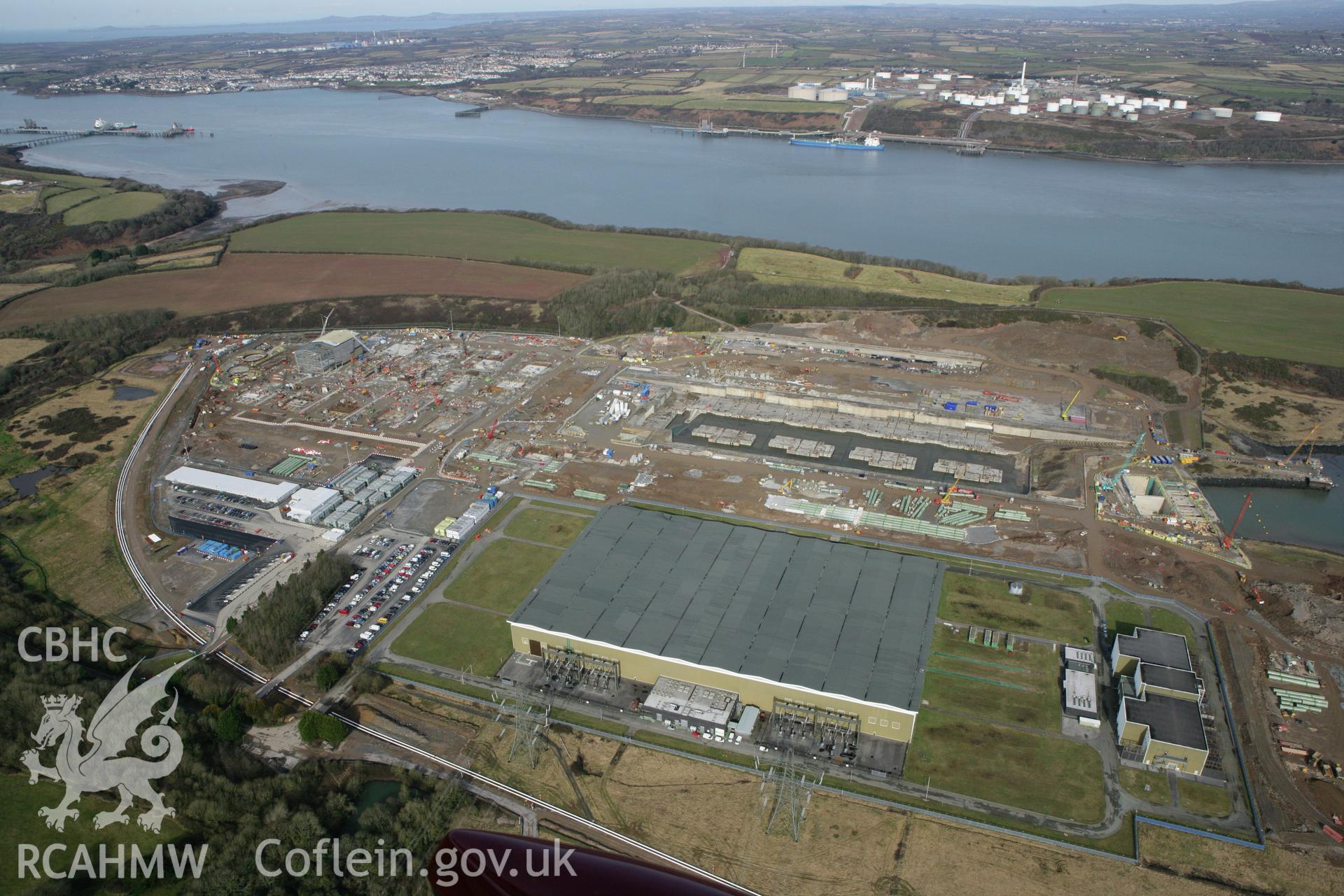 RCAHMW colour oblique aerial photograph of Pembroke Power Station site. Taken on 02 March 2010 by Toby Driver