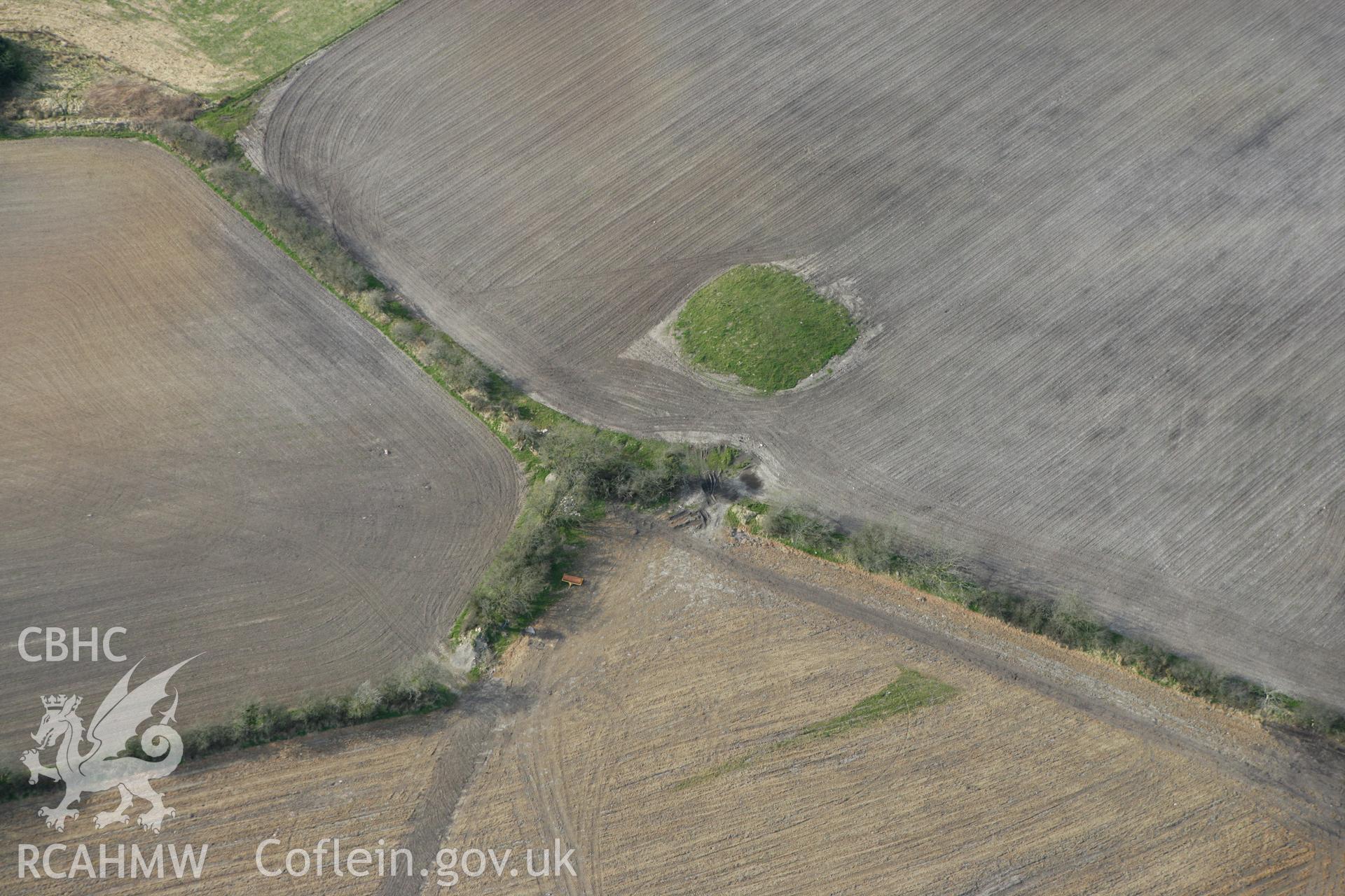 RCAHMW colour oblique aerial photograph of Crug Bach with ploughing. Taken on 13 April 2010 by Toby Driver