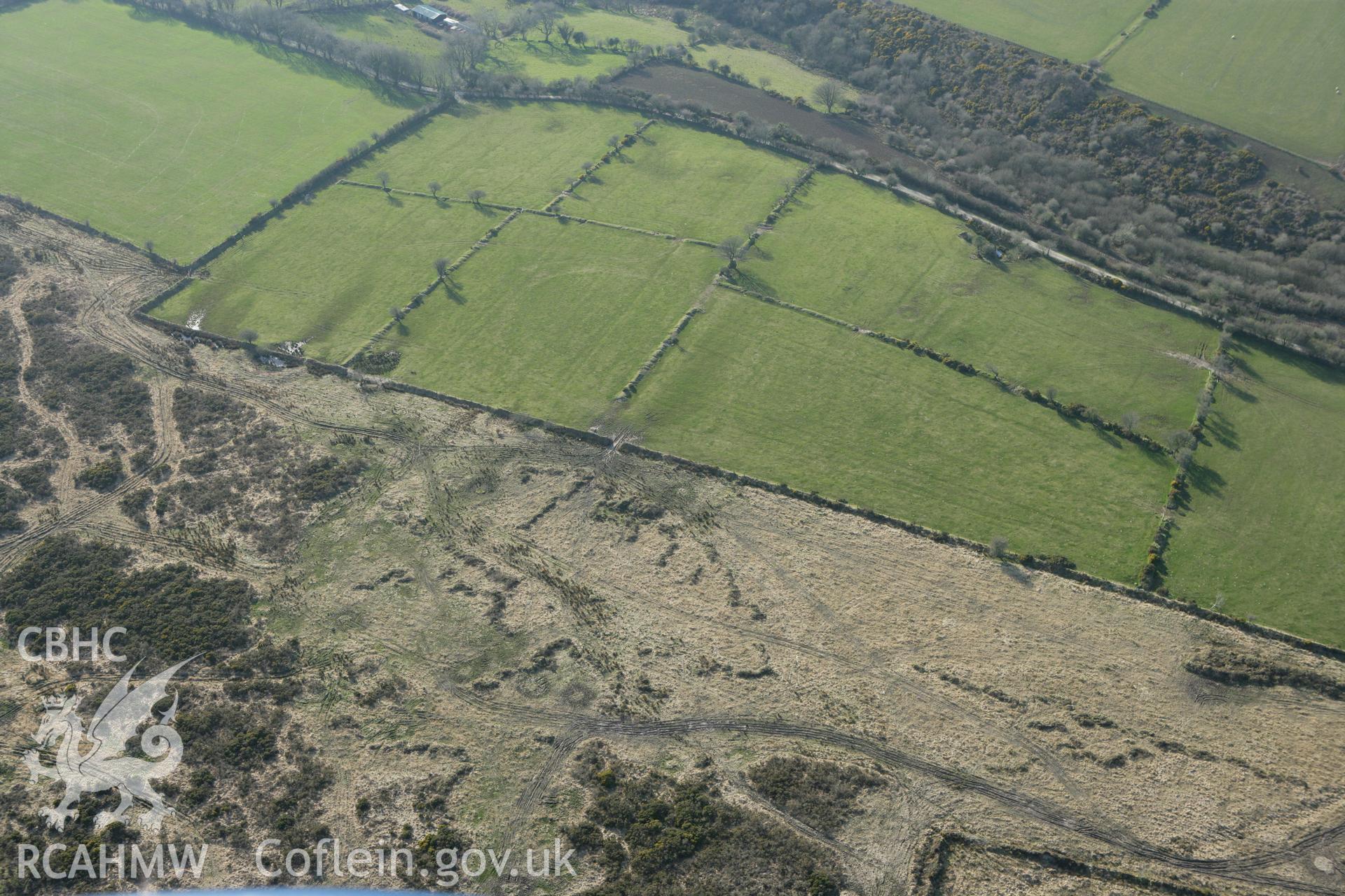 RCAHMW colour oblique aerial photograph of Crugelwin Barrow, Cilymaenllwyd. Taken on 13 April 2010 by Toby Driver