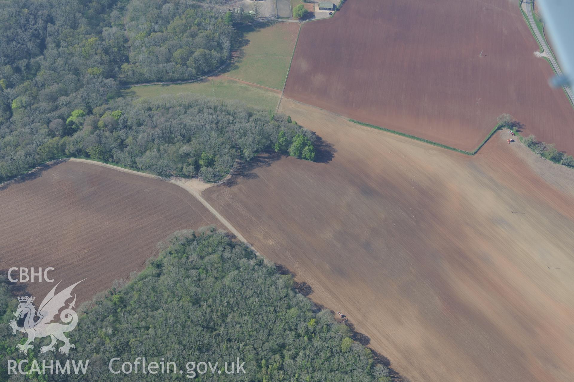 Soilmark enclosures near Nutstalks Wood. Oblique aerial photograph taken during the Royal Commission's programme of archaeological aerial reconnaissance by Toby Driver on 21st April 2015.