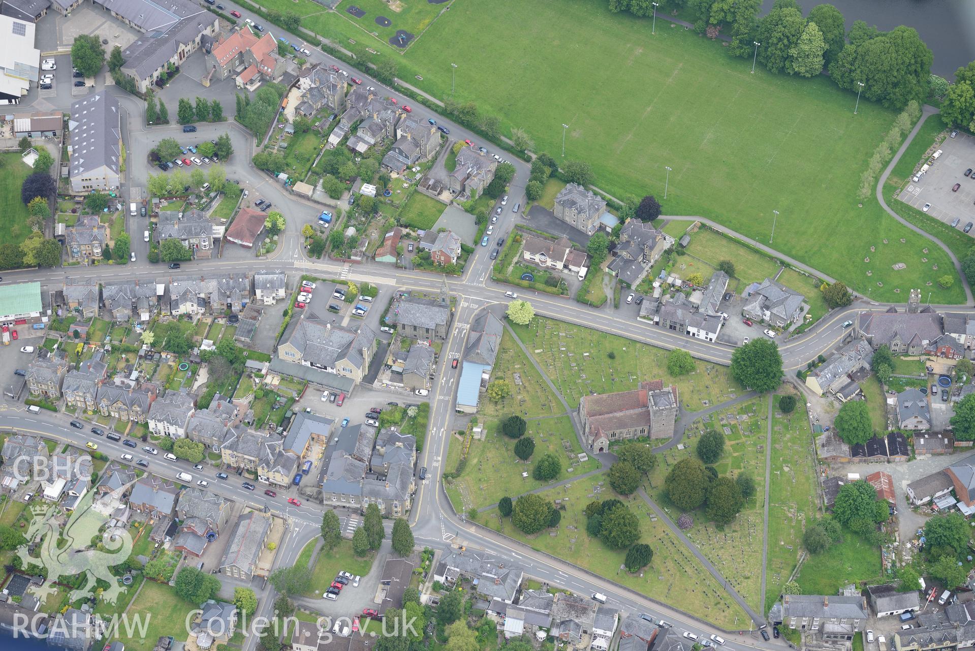 Builth Wells including Park Road primary school; Alpha Calvinistic Methodist Chapel and St. Mary's parish church. Oblique aerial photograph taken during the Royal Commission's programme of archaeological aerial reconnaissance by Toby Driver on 11/6/2015.