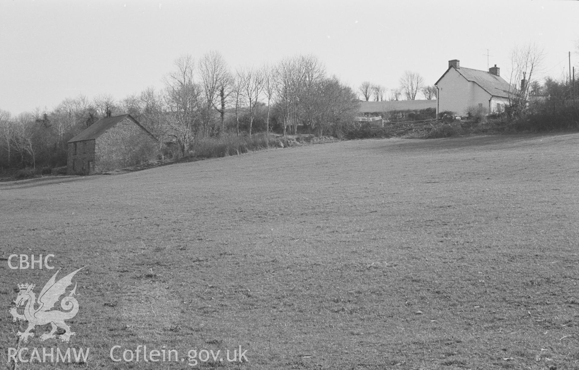 Digital copy of a black and white negative showing farm buildings 600m east south east of Caerwedros crossroads, seen from the bridge across Afon Soden. Photographed by Arthur O. Chater on 11th April 1968, looking south from Grid Reference SN 382 558.