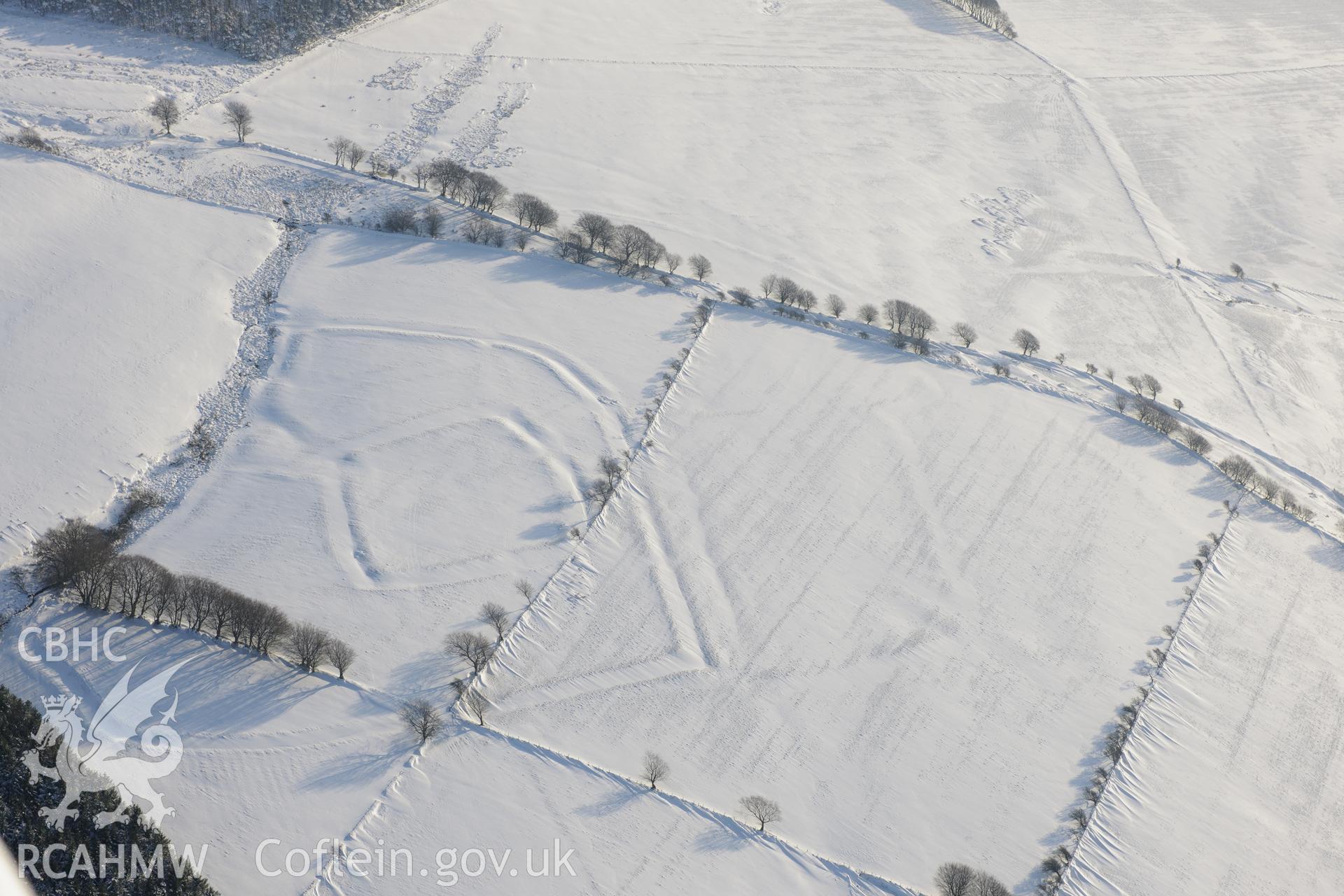 Moel Ton-Mawr hillfort and field system. Oblique aerial photograph taken during the Royal Commission?s programme of archaeological aerial reconnaissance by Toby Driver on 24th January 2013.