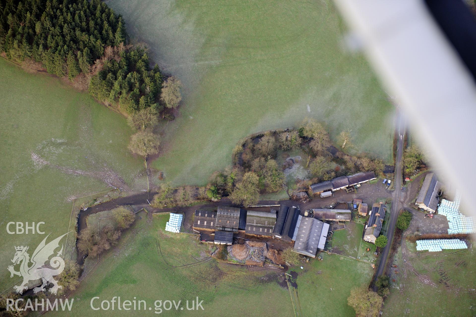 Glan-Mynys mount castle and motte, LLanwrda, south west of Llandovery. Oblique aerial photograph taken during the Royal Commission?s programme of archaeological aerial reconnaissance by Toby Driver on 15th January 2013.