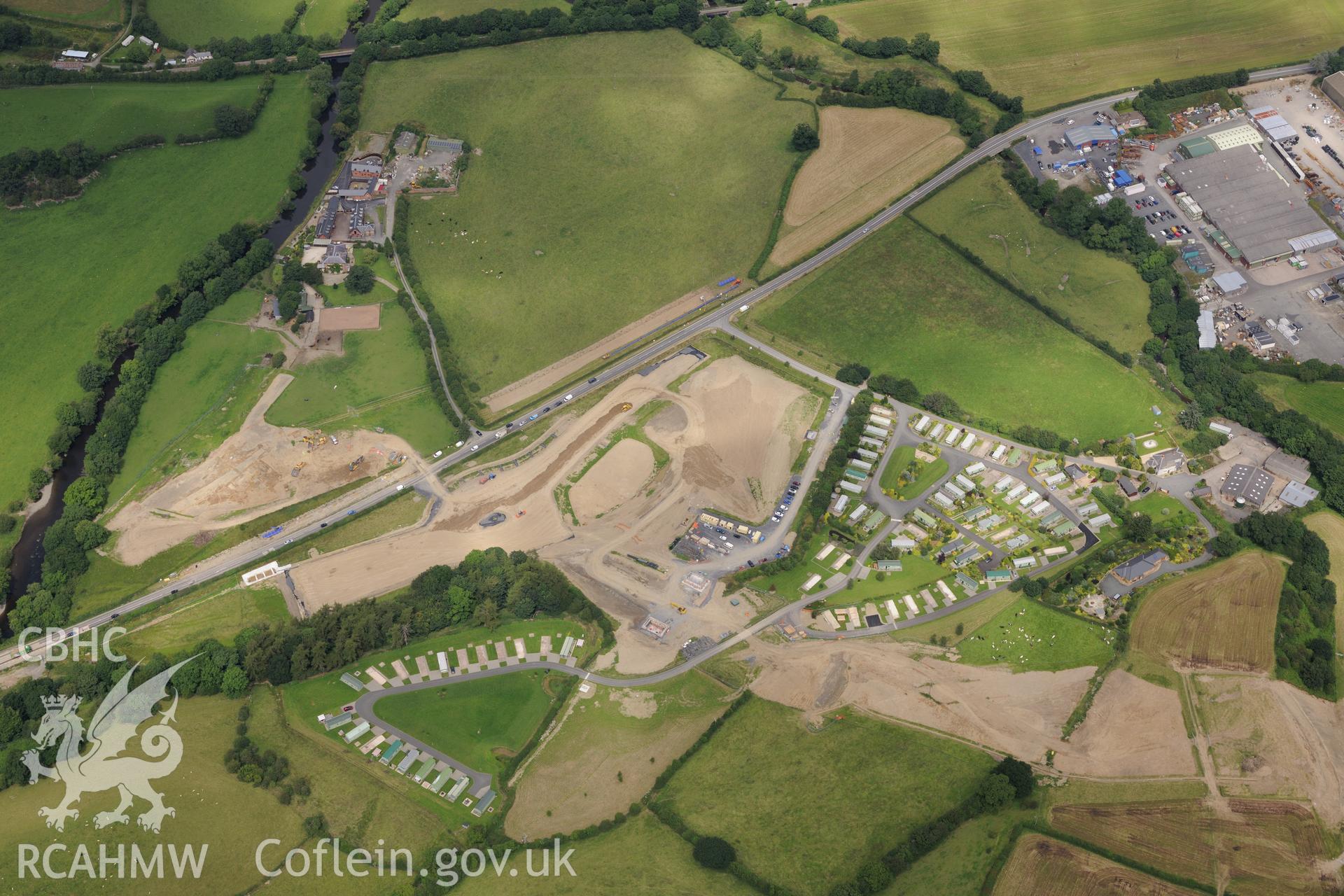 Royal Commission aerial reconnaissance of the construction of the Newtown Bypass. View near Glanhafren Hall (SO 083 902) with excavation of Roman road in progress