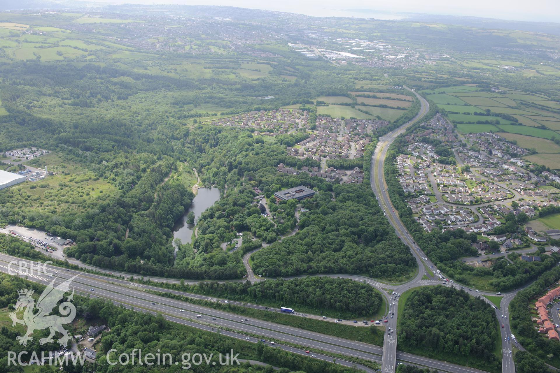 Lliw Valley (or Penllergaer) Civic centre at Penllergaer Park, and the village of Penllergaer. Oblique aerial photograph taken during the Royal Commission's programme of archaeological aerial reconnaissance by Toby Driver on 19th June 2015.