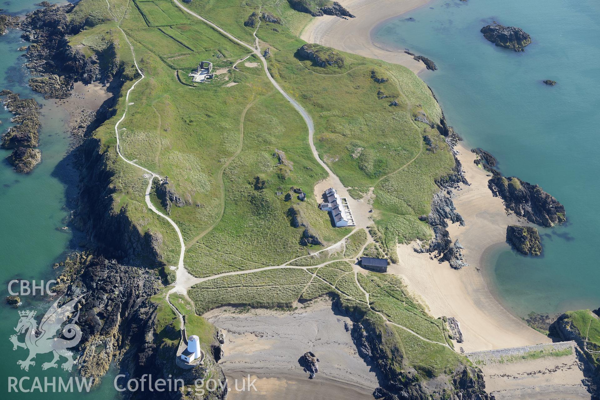 The lighthouse, pilot's house and St. Dwynwen's Church on Llanddwyn Island. Oblique aerial photograph taken during the Royal Commission's programme of archaeological aerial reconnaissance by Toby Driver on 23rd June 2015.