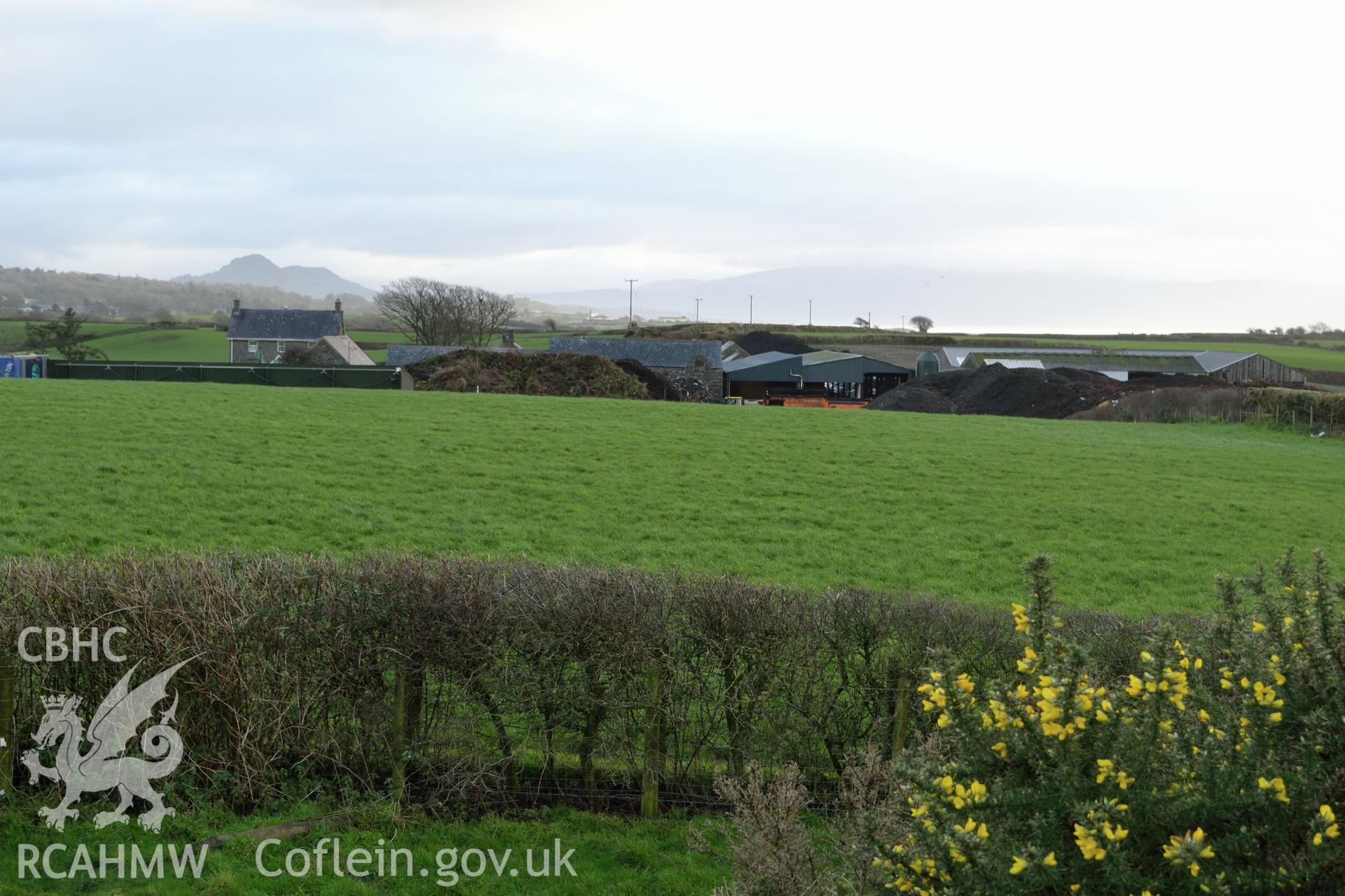 View from top of Tomen Fawr toward field of new development, photographed by Gwynedd Archaeological Trust during impact assessment of the site on 20th December 2018. Project no. G2564.