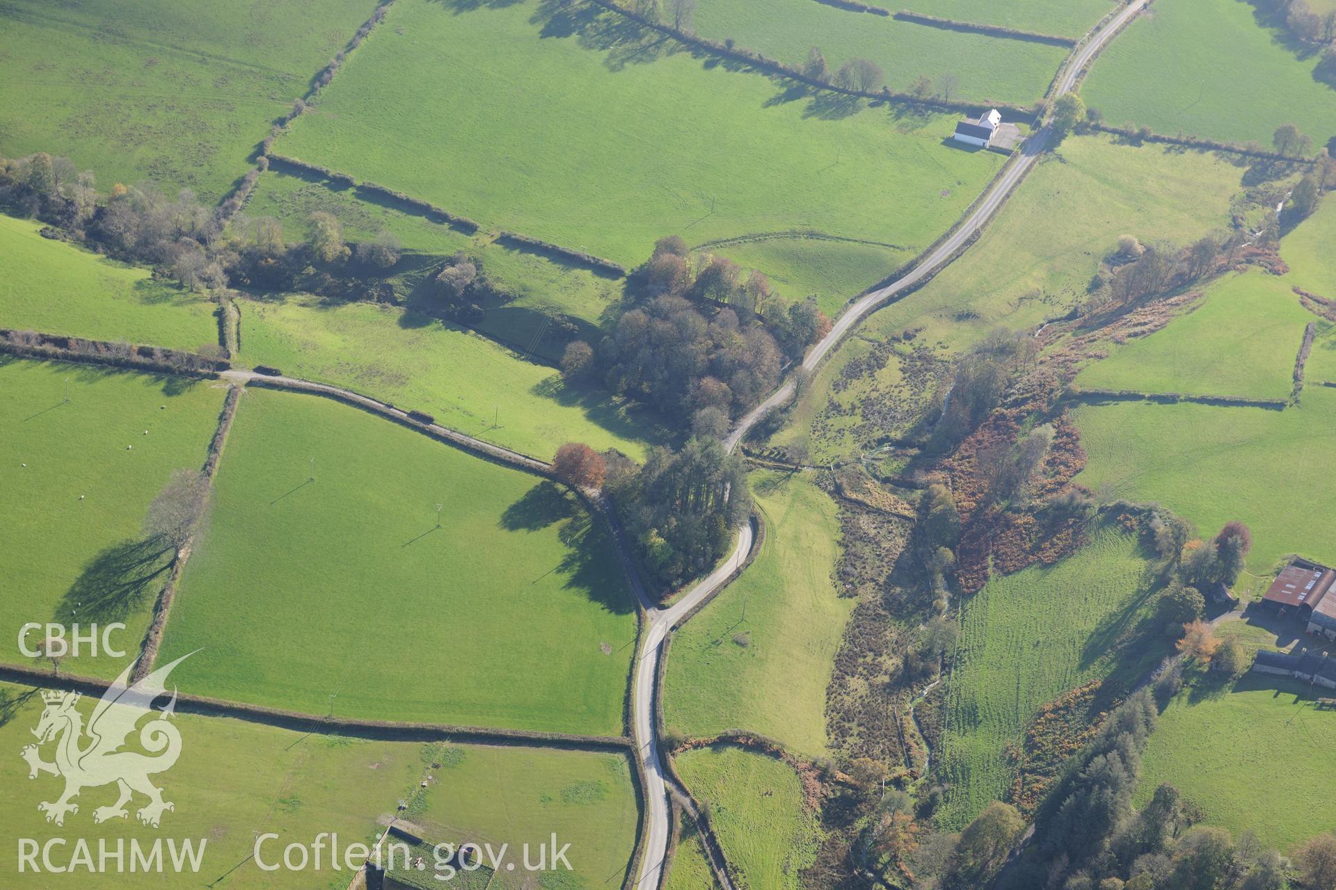 Castell Hywel motte and possible site of battle near Rhydowen, Llandysul. Oblique aerial photograph taken during the Royal Commission's programme of archaeological aerial reconnaissance by Toby Driver on 2nd November 2015.