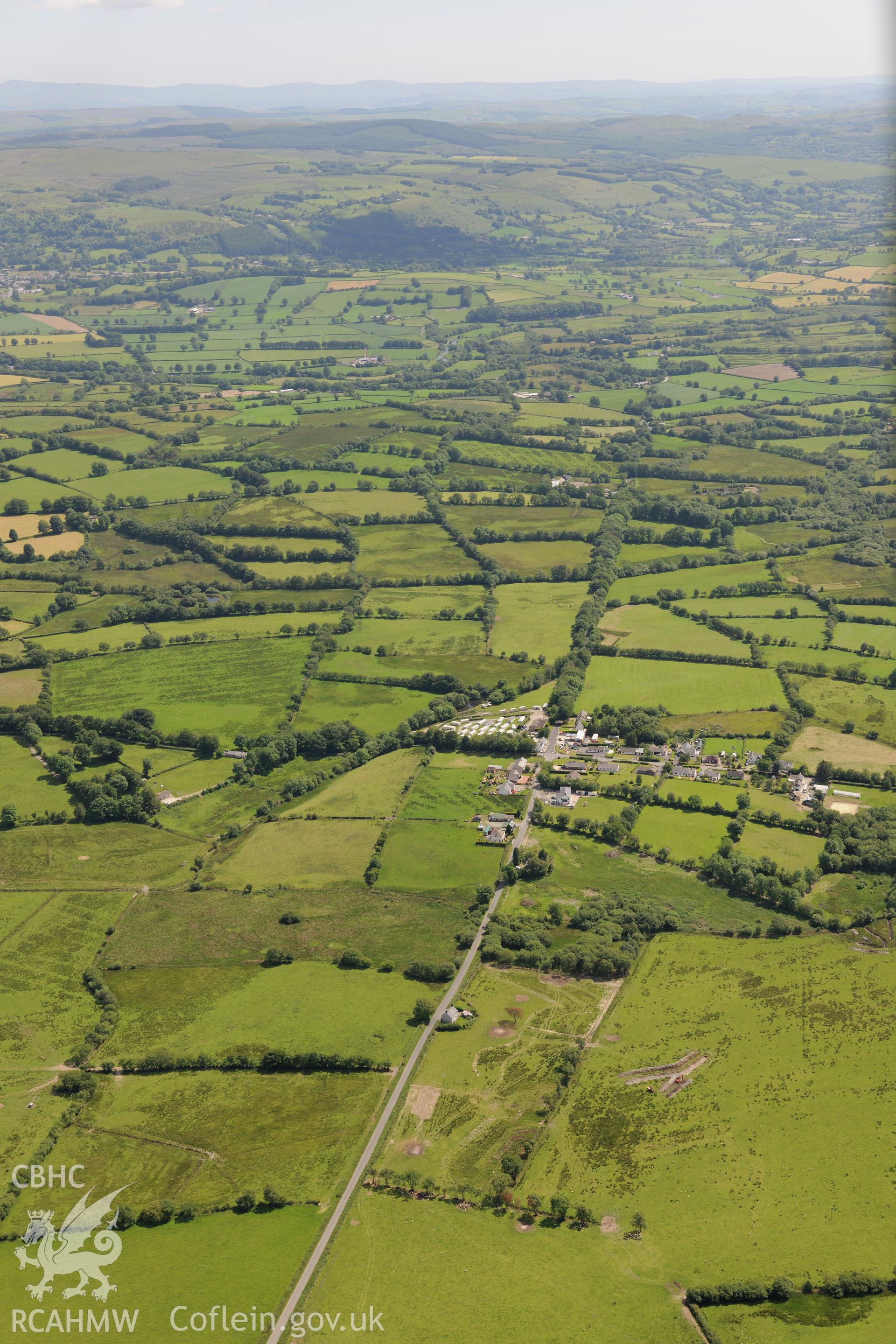 Section of Sarn Helen Roman Road running from Llanio-Isaf, through the hamlet of Stag's Head and up to Tyncelyn, near Tregaron. Oblique aerial photograph taken during the Royal Commission's programme of archaeological aerial reconnaissance by Toby Driver on 30th June 2015.