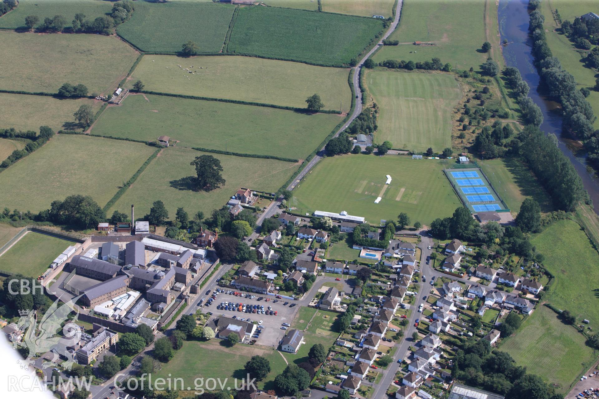 The Session House, H.M. Prison, Usk, and Usk Roman site: 'Burrium.' Oblique aerial photograph taken during the Royal Commission?s programme of archaeological aerial reconnaissance by Toby Driver on 1st August 2013.