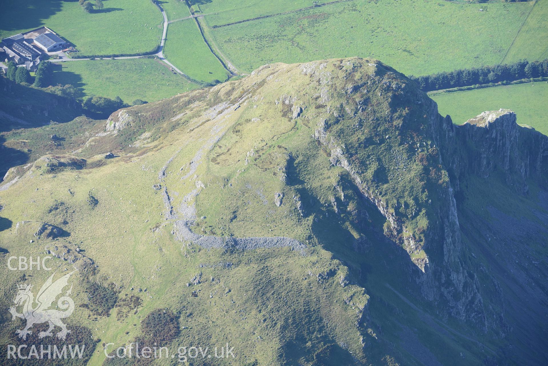 Hillfort on Bird's Rock, near Abergynolwyn. Oblique aerial photograph taken during the Royal Commission's programme of archaeological aerial reconnaissance by Toby Driver on 2nd October 2015.