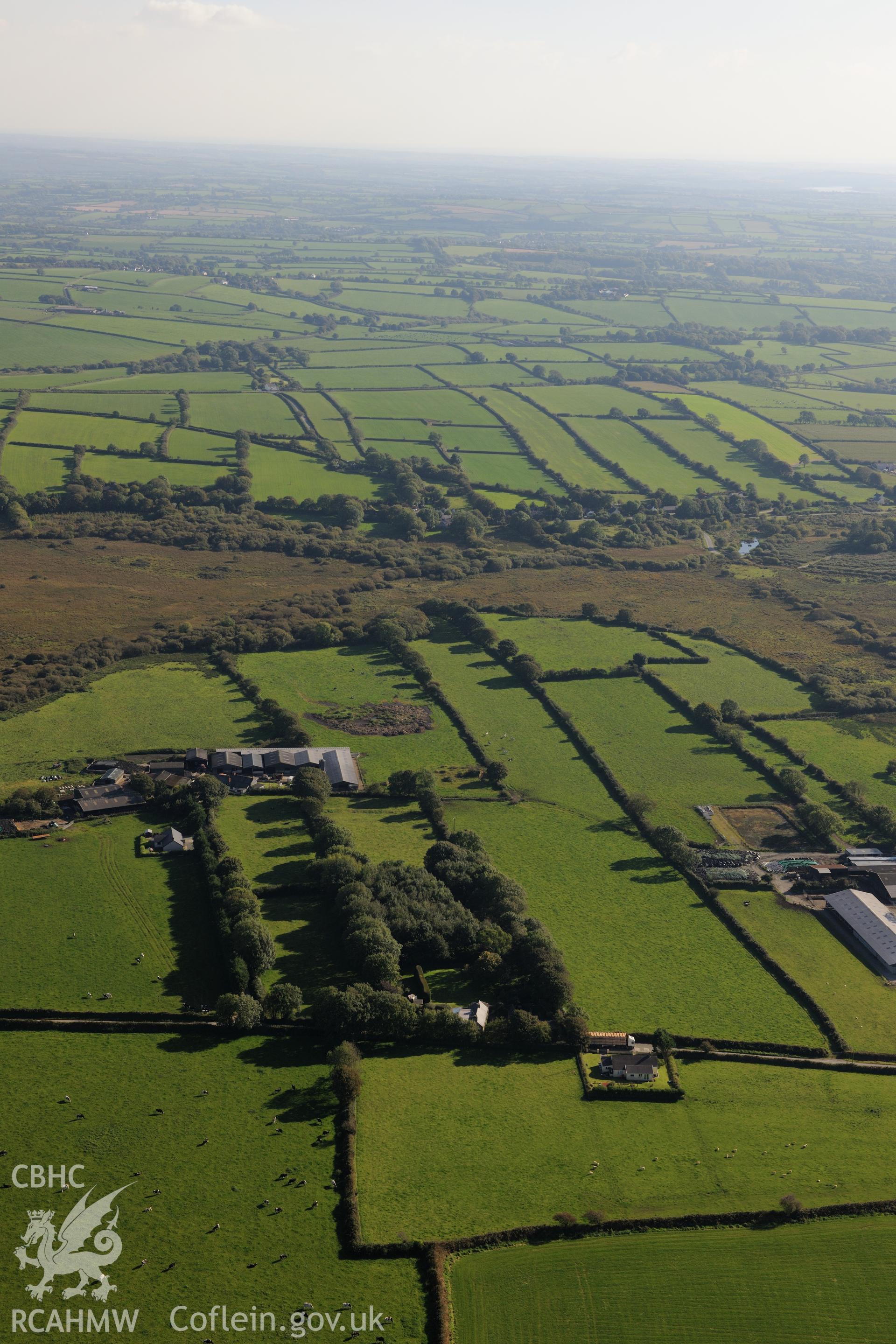 Medieval strip field system between Fleming's Castle farm and the village of Wallis, Pembrokeshire. Oblique aerial photograph taken during the Royal Commission's programme of archaeological aerial reconnaissance by Toby Driver on 30th September 2015.