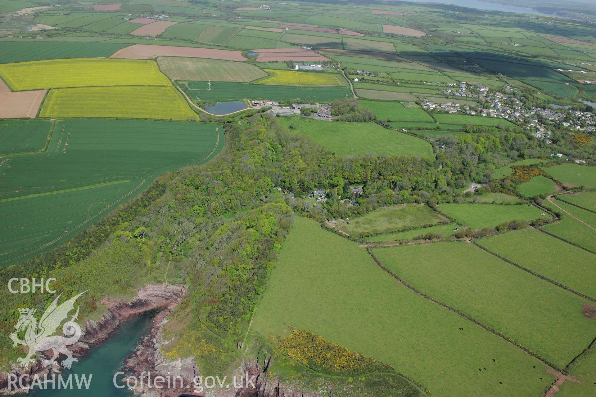 Trewarren House with St. Ishmael's in the distance. Oblique aerial photograph taken during the Royal Commission's programme of archaeological aerial reconnaissance by Toby Driver on 13th May 2015.