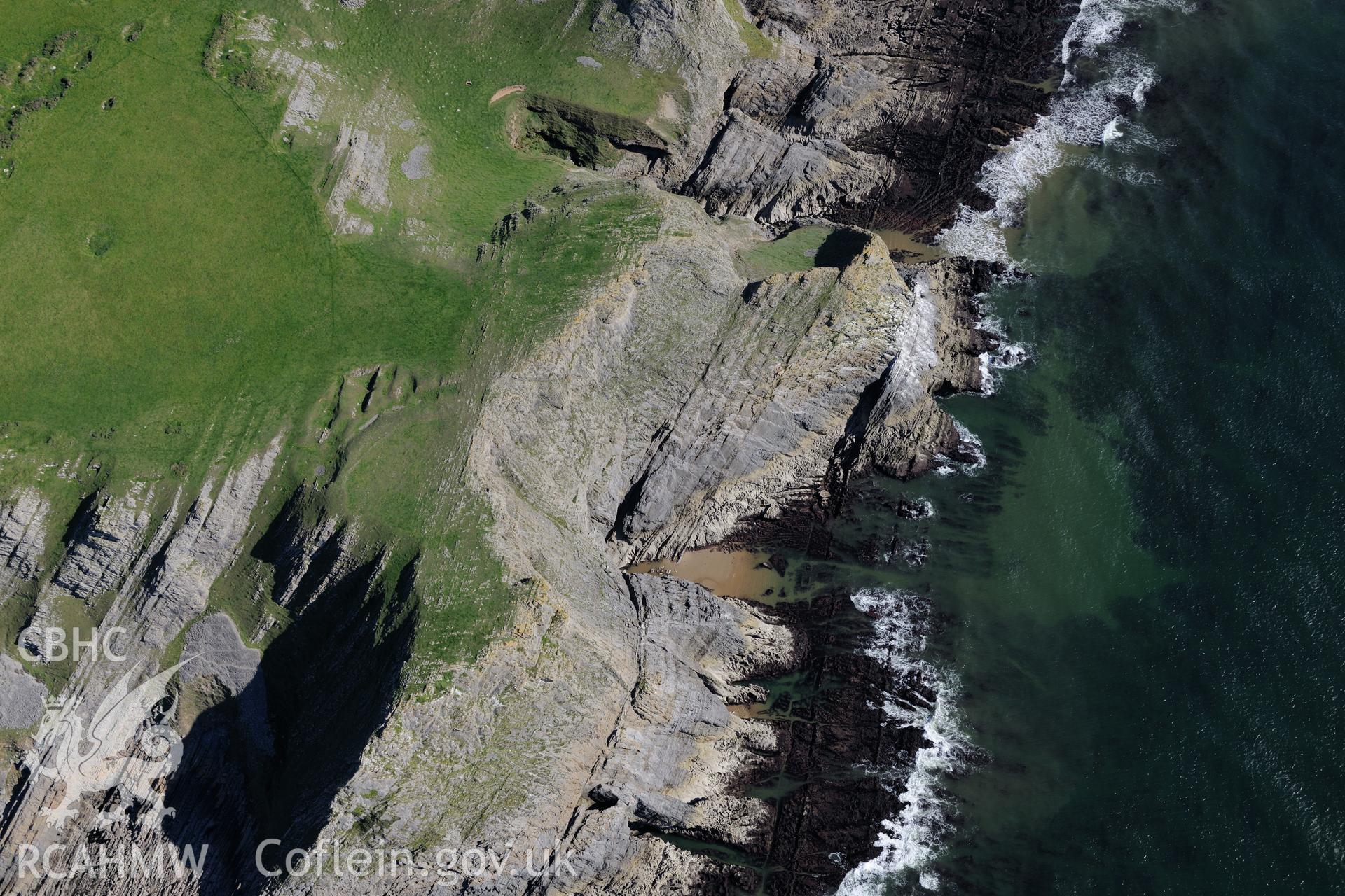 Horse Cliff promontory fort, on the south western shore of the Gower Peninsula. Oblique aerial photograph taken during the Royal Commission's programme of archaeological aerial reconnaissance by Toby Driver on 30th September 2015.