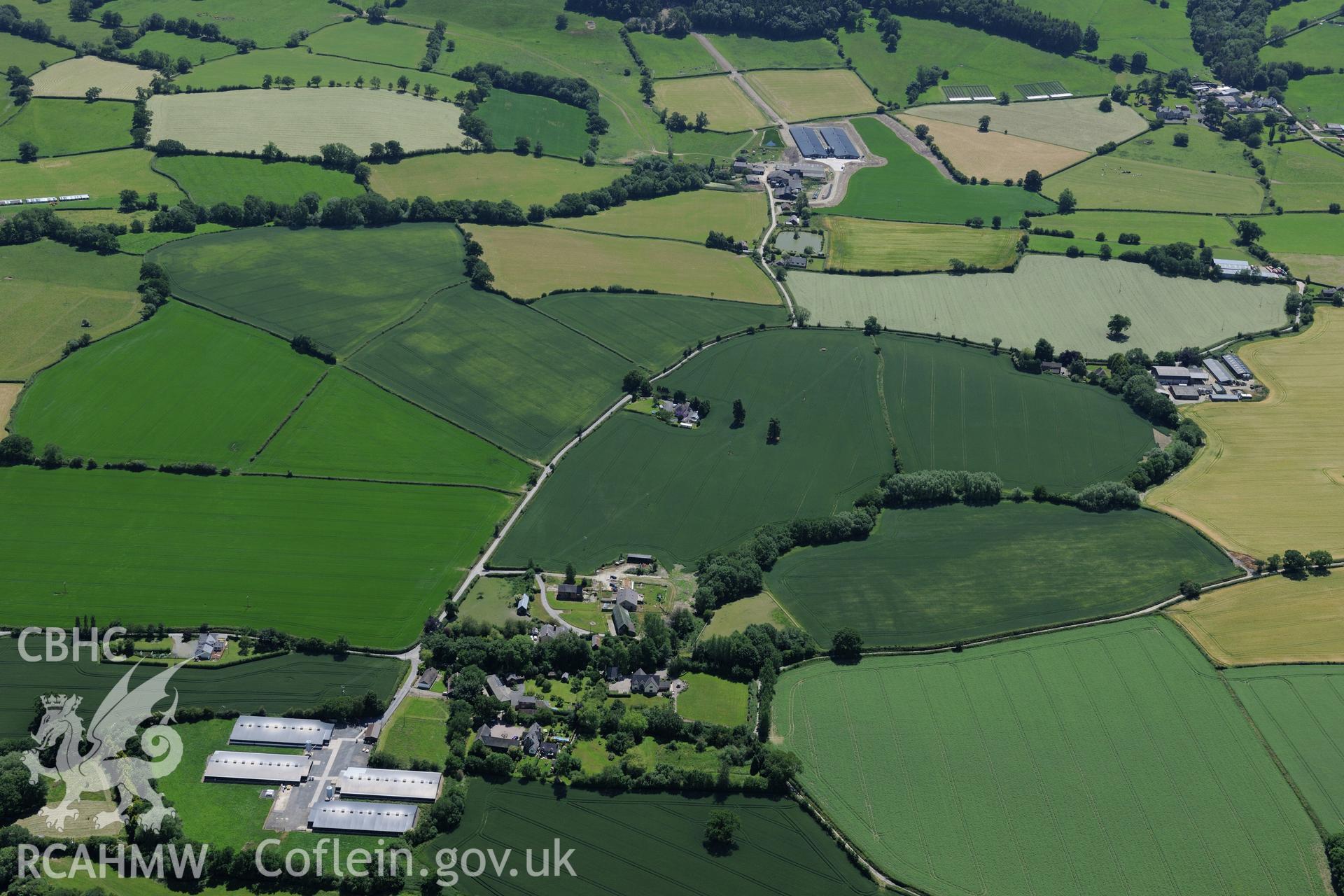 Bacheldre hall, farmhouse and defended enclosure, south of Montgomery. Oblique aerial photograph taken during the Royal Commission's programme of archaeological aerial reconnaissance by Toby Driver on 30th June 2015.