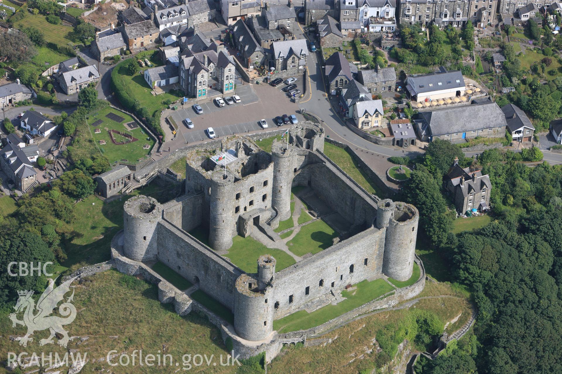 Harlech Castle, overlooking Harlech. Oblique aerial photograph taken during the Royal Commission?s programme of archaeological aerial reconnaissance by Toby Driver on 12th July 2013.