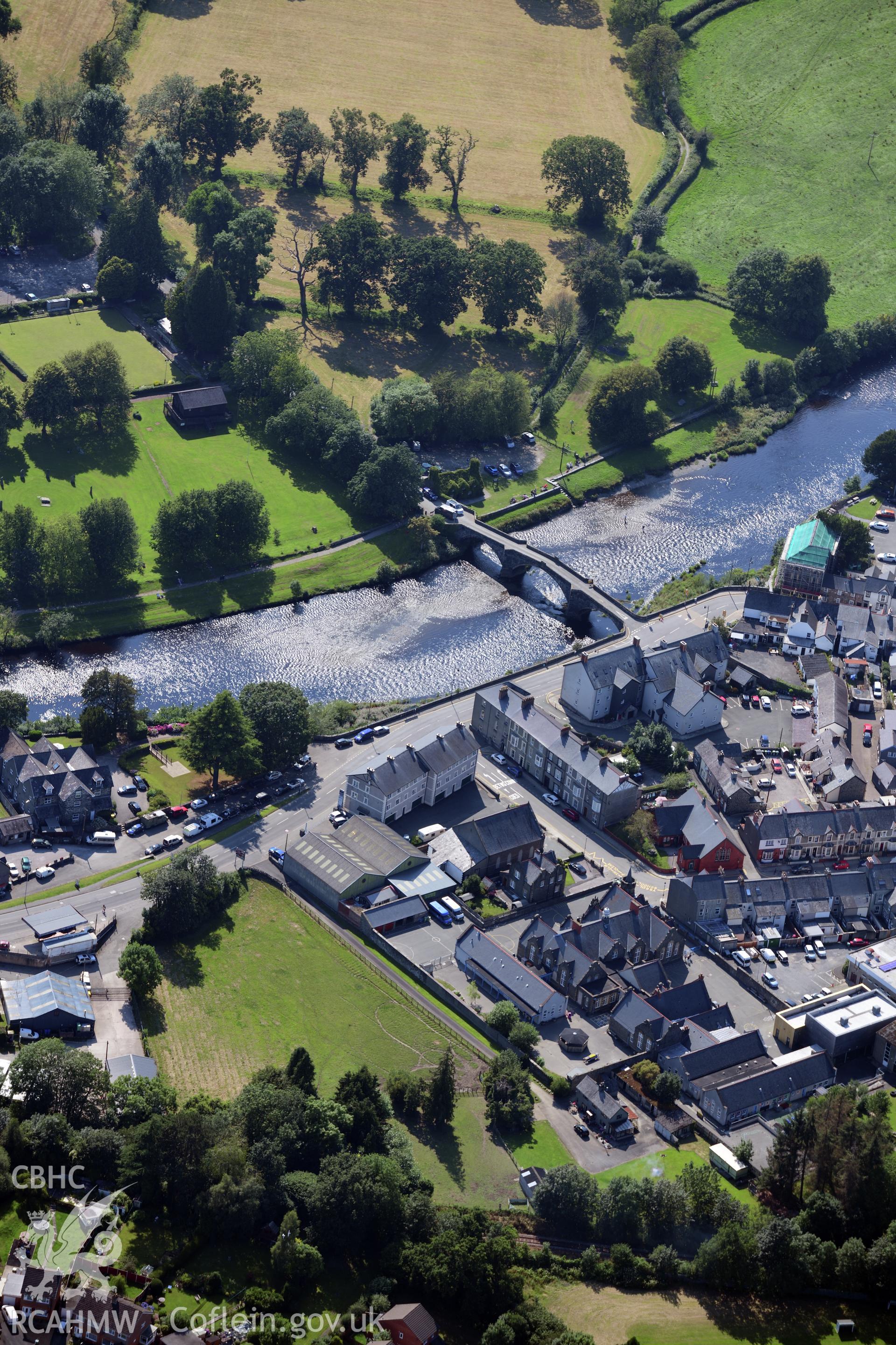 The town of Llanrwst, with Pont Fawr crossing the river Conwy. Oblique aerial photograph taken during the Royal Commission?s programme of archaeological aerial reconnaissance by Toby Driver on 23rd July 2019.