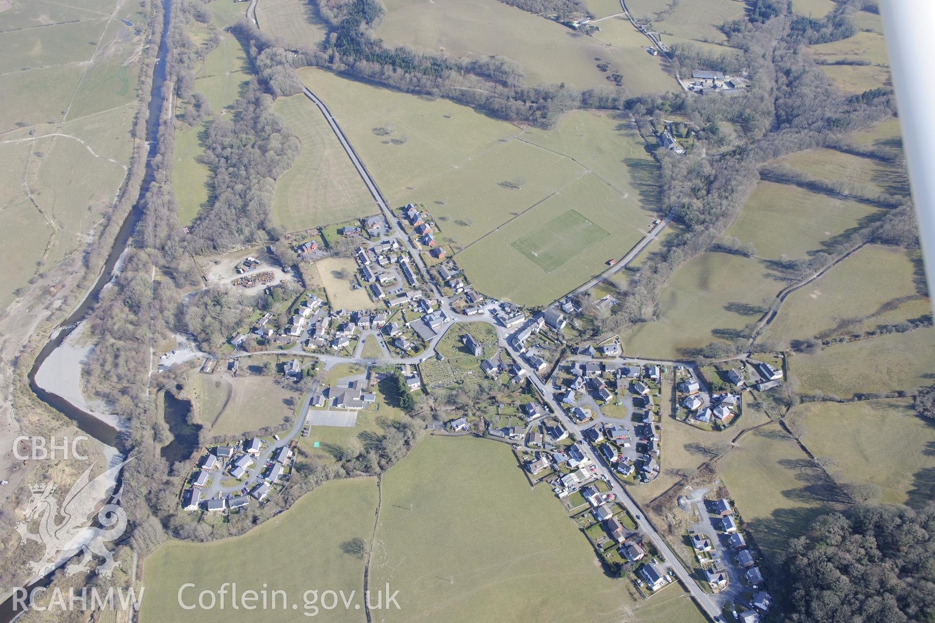 The village of Llanilar, south east of Aberystwyth, with St. Hilary's church at it's centre. Oblique aerial photograph taken during the Royal Commission?s programme of archaeological aerial reconnaissance by Toby Driver on 2nd April 2013.