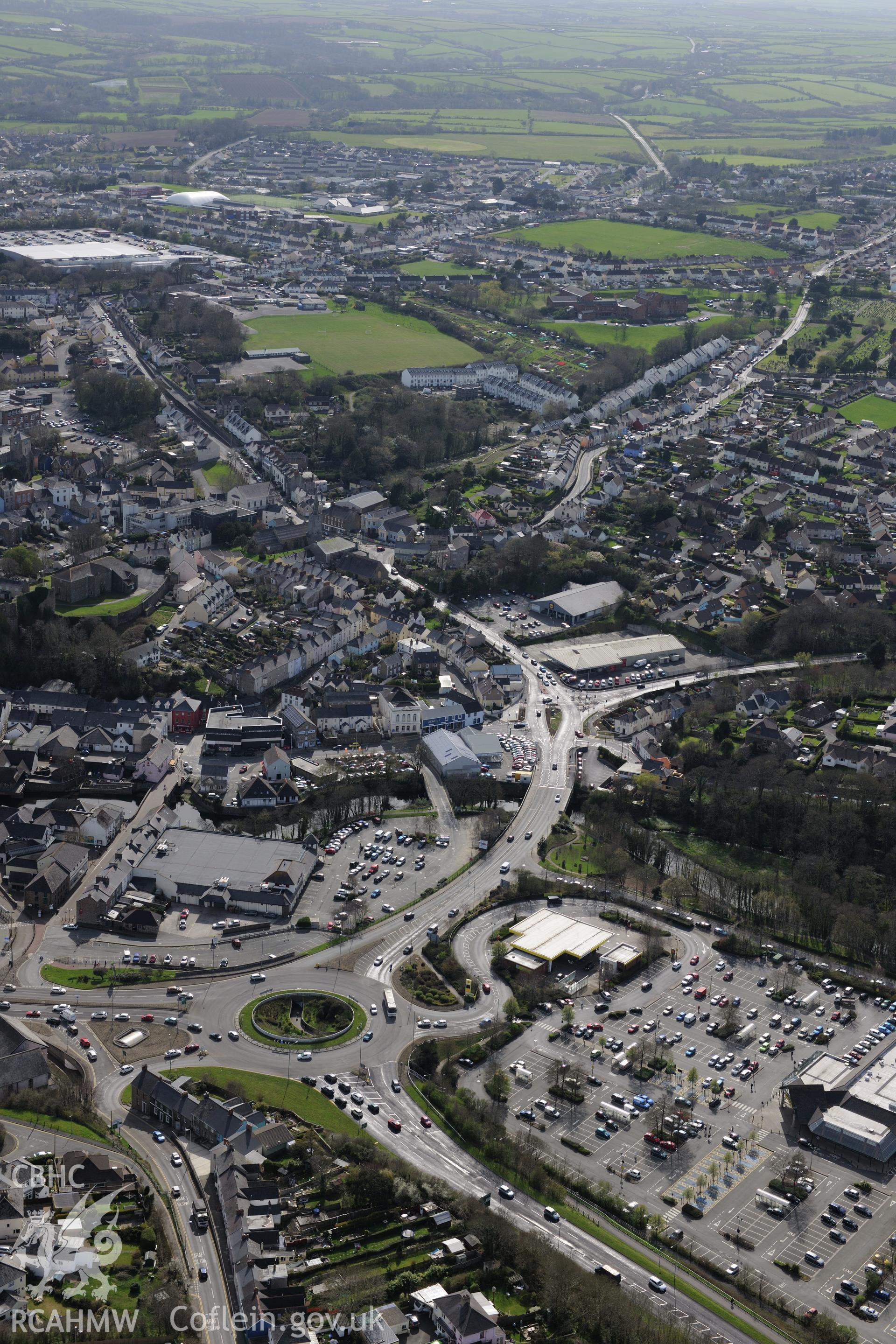 Haverford West, Haverfordwest Castle, (former) Gaol and St Martin's Church (just seen). Oblique aerial photograph taken during the Royal Commission's programme of archaeological aerial reconnaissance by Toby Driver on 15th April 2015.