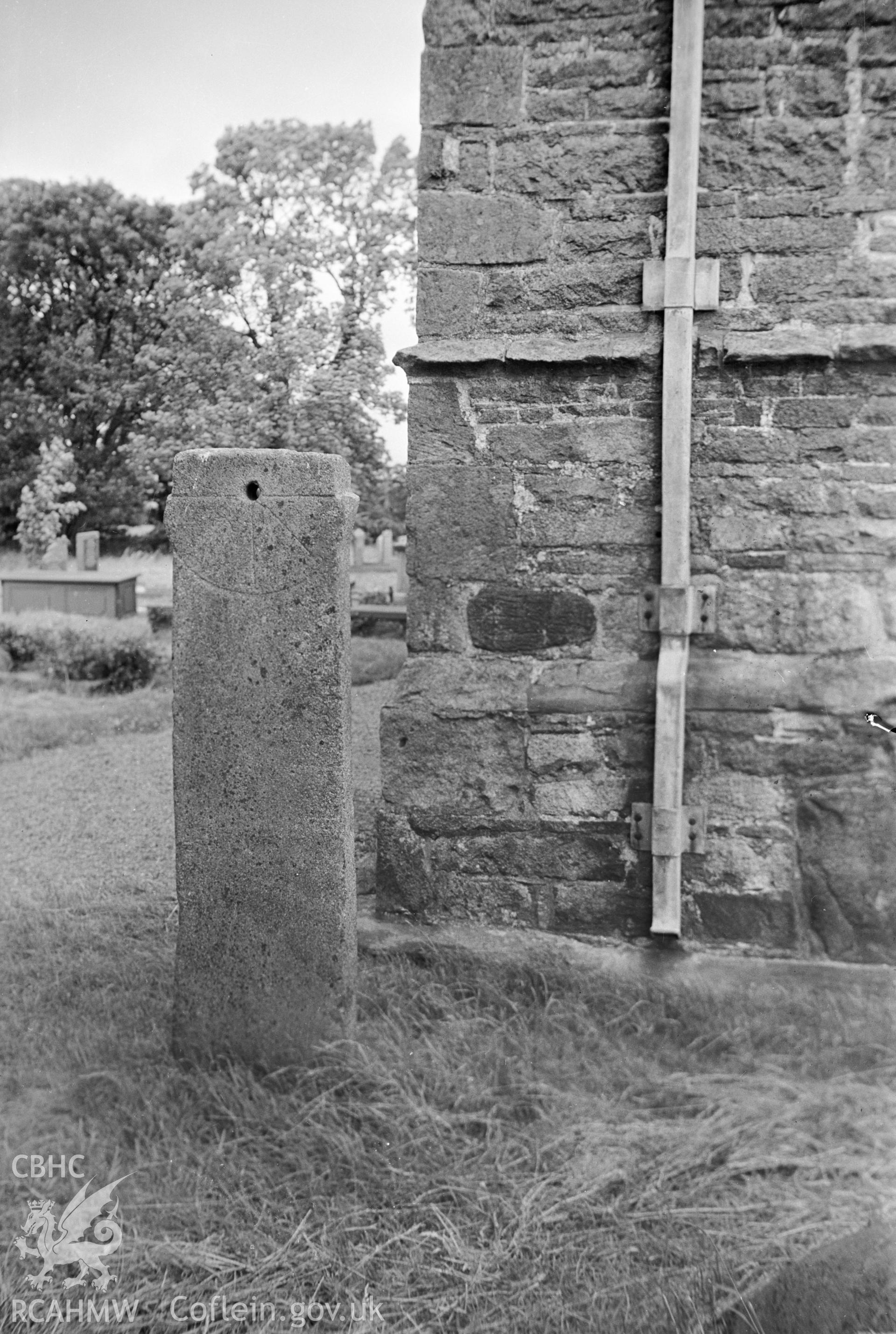 Digital copy of a nitrate negative showing sundial in Clynnog Churchyard.