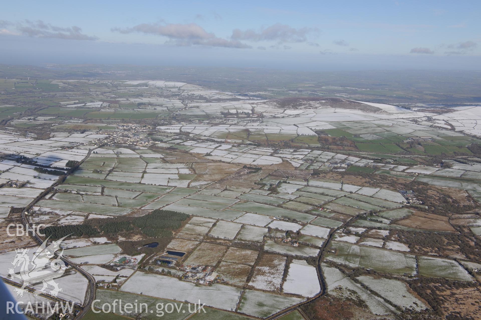 View from the south of Crymych and the surrounding countryside. Oblique aerial photograph taken during the Royal Commission's programme of archaeological aerial reconnaissance by Toby Driver on 4th February 2015.