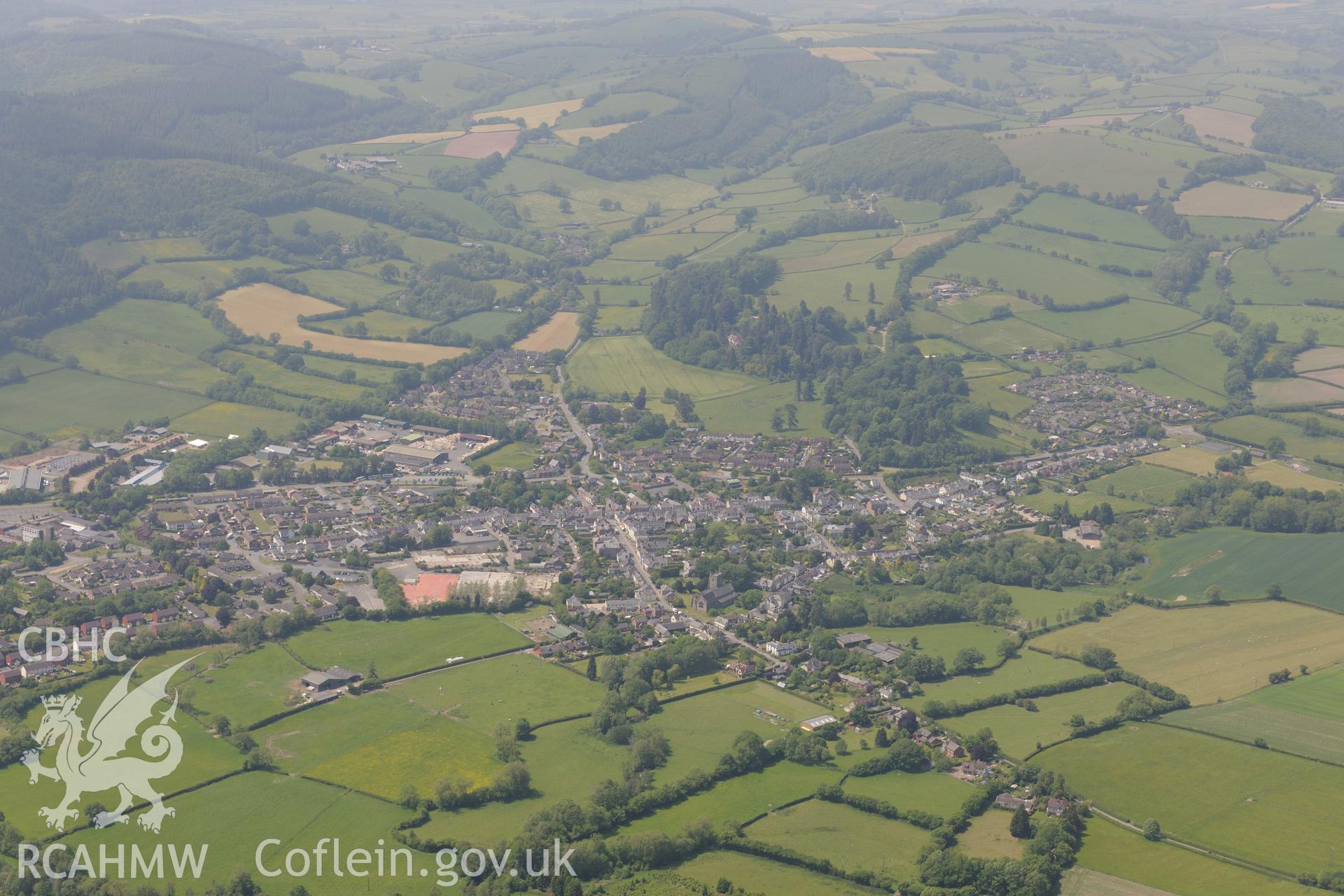 St. Andrews church and general view of Prestigne. Oblique aerial photograph taken during the Royal Commission's programme of archaeological aerial reconnaissance by Toby Driver on 11th June 2015.