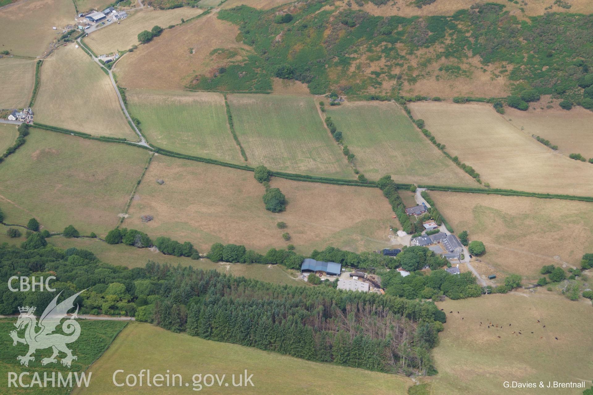 Aerial photograph of ring ditch cropmark at Dyffryn Gwyn Farm taken by Glyn Davies and Jonathan Brentnall on 17/07/2018, under drought conditions. For modified version of this photo, highlighting archaeological features, see BDC_03_01_01.