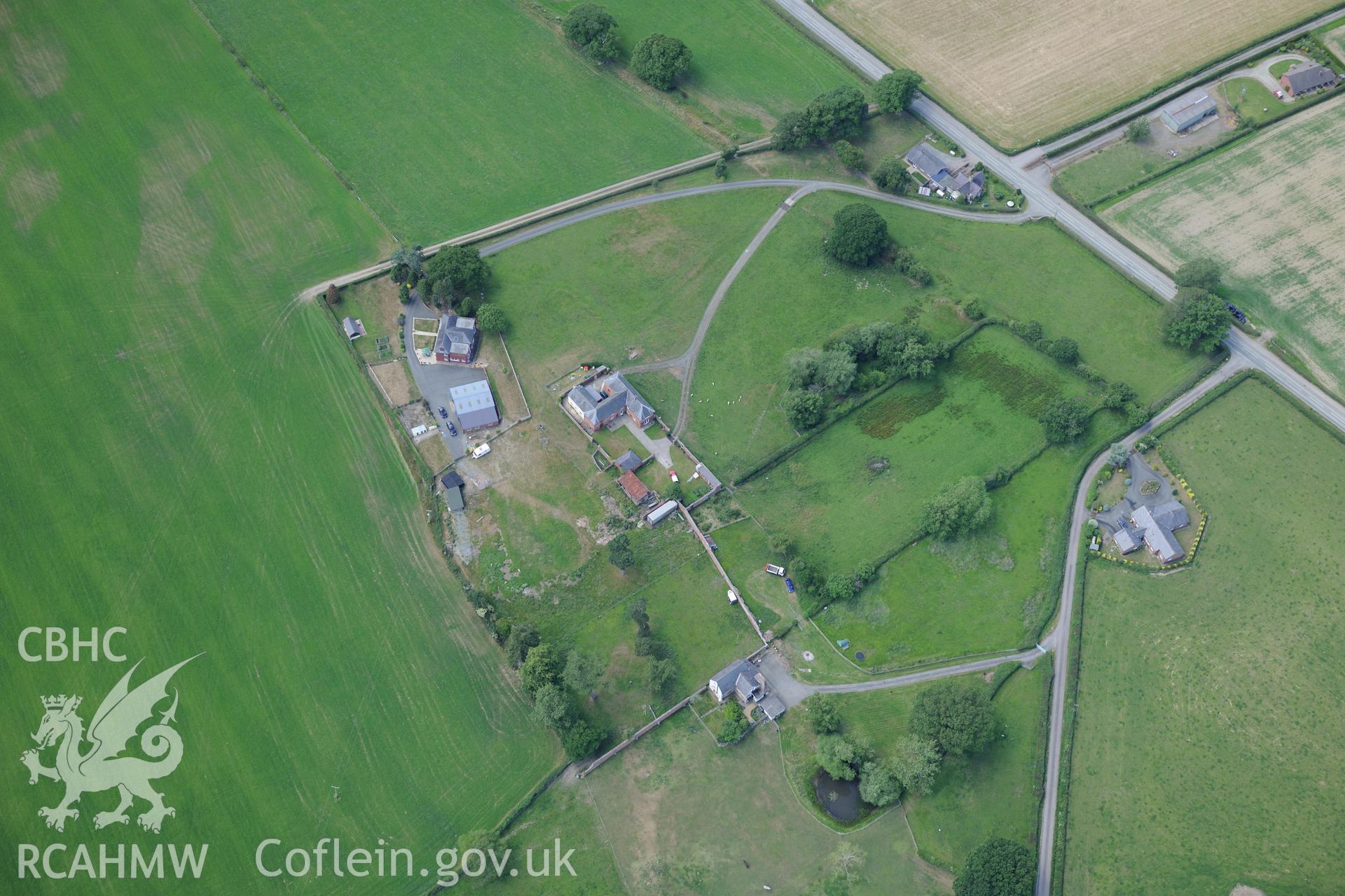 Nant Cribiau garden and the section of Offa's Dyke on the southern boundary of Nant-Cribau park, near Forden. Oblique aerial photograph taken during the Royal Commission?s programme of archaeological aerial reconnaissance by Toby Driver on 30th June 2015.