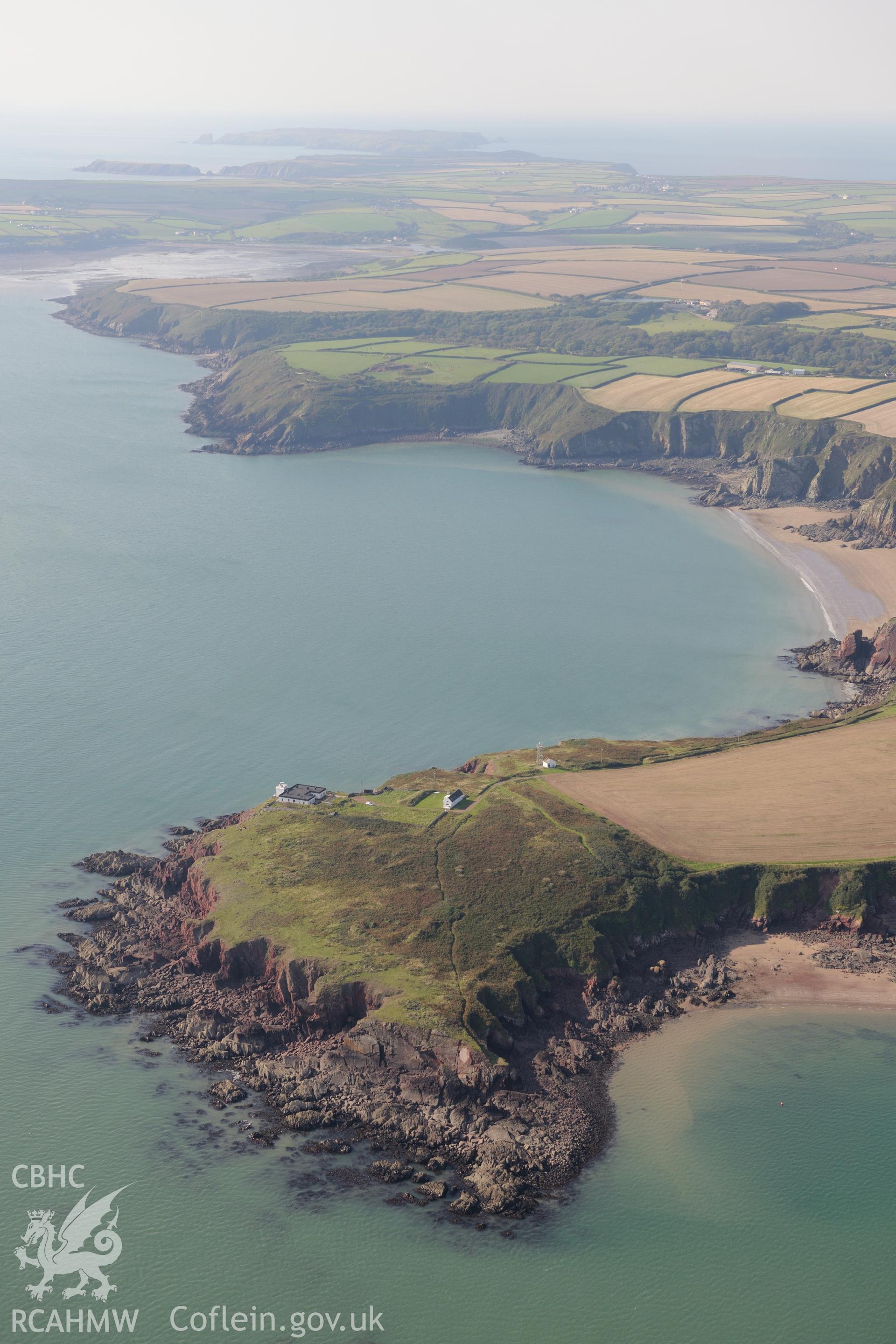 Great Castle Head, the Leading Lights Sandyhaven Estate and the estate's Summerhouse, St. Ishmaels, west of Milford Haven. Oblique aerial photograph taken during the Royal Commission's programme of archaeological aerial reconnaissance by Toby Driver on 30th September 2015.