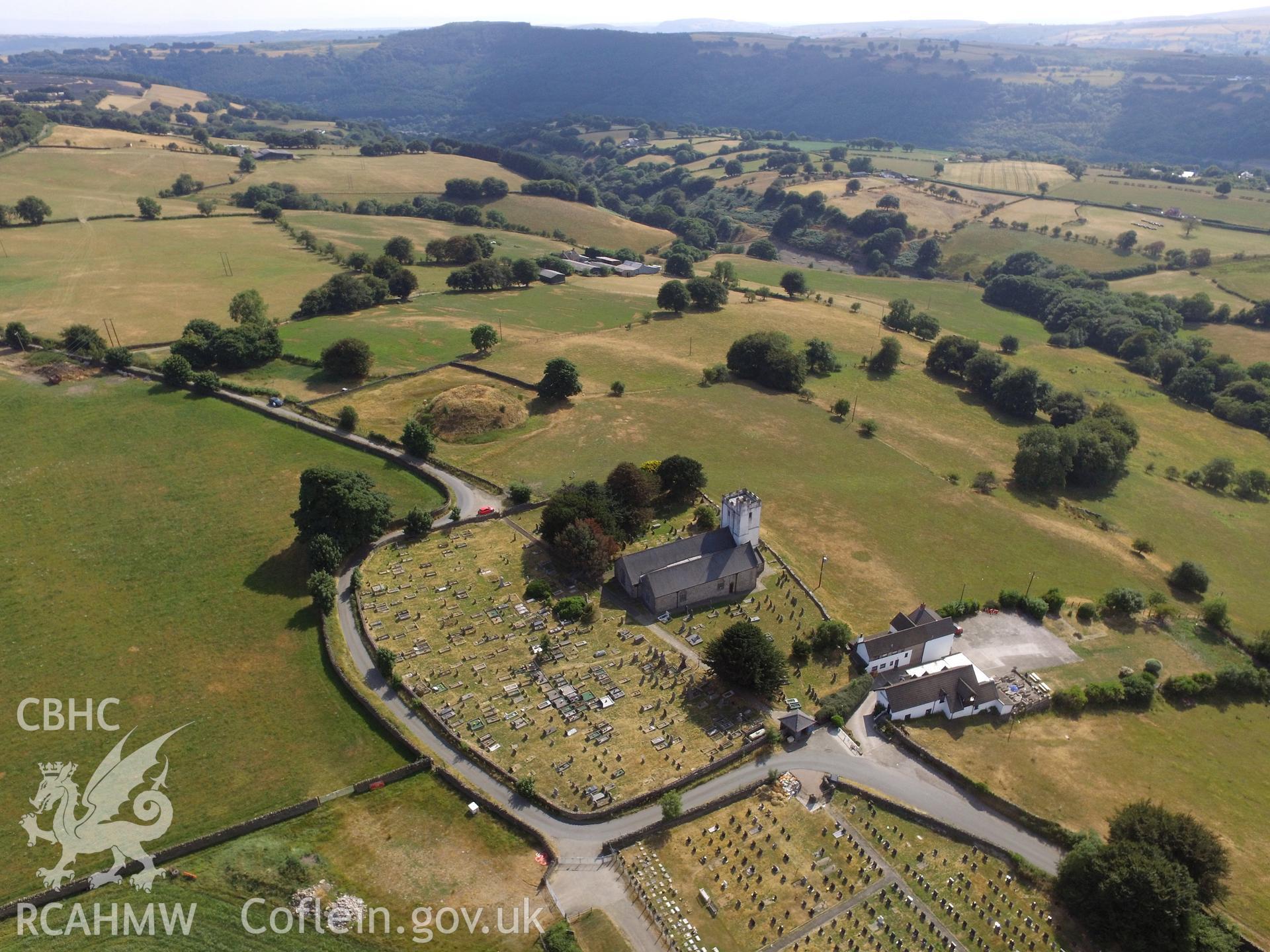 Aerial view of St. Tudur's church and Tywyn Tudur Motte, Mynyddislwyn, Ynysddu, north west of Newport. Colour photograph taken by Paul R. Davis on 19th July 2018.